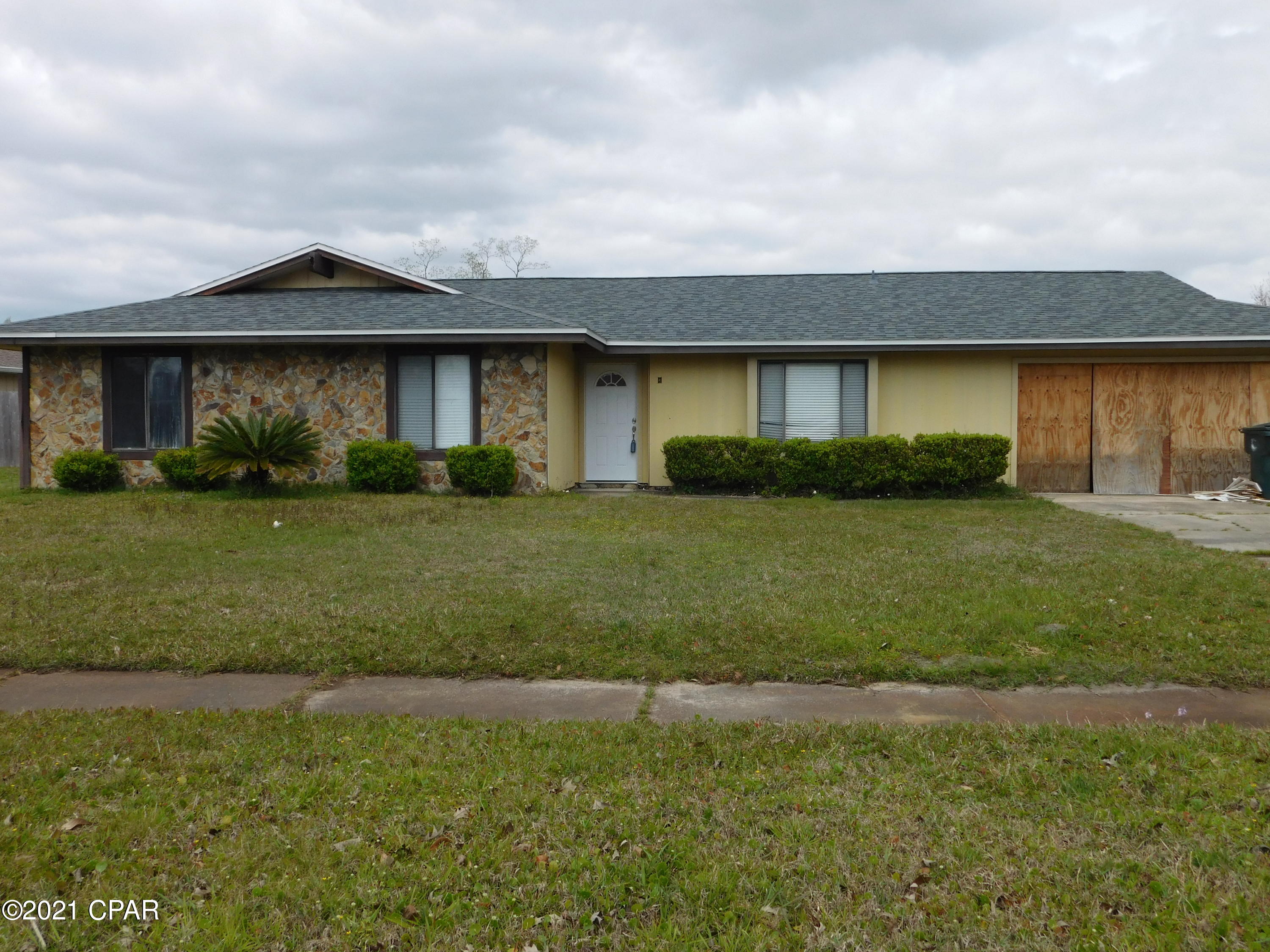 Looking for a minor fixer upper? Check out this 3 bedroom, 2 bath home with over 1800 heated and cooled sqft, a nice size yard, and a 2 car garage in Belaire Estates. The roof has been replaced. The interior of this great home offers an open floor plan with a separate formal dining area that could be used as an office or kids play room.. The bedrooms are all good size.  and The exterior offers plenty of parking space and there is room for a pool and/or shed in the back yard. The interior has been repainted since the original photos were taken to a nice light grey and the cabinets have been painted. Call your Realtor today and make this home your own.