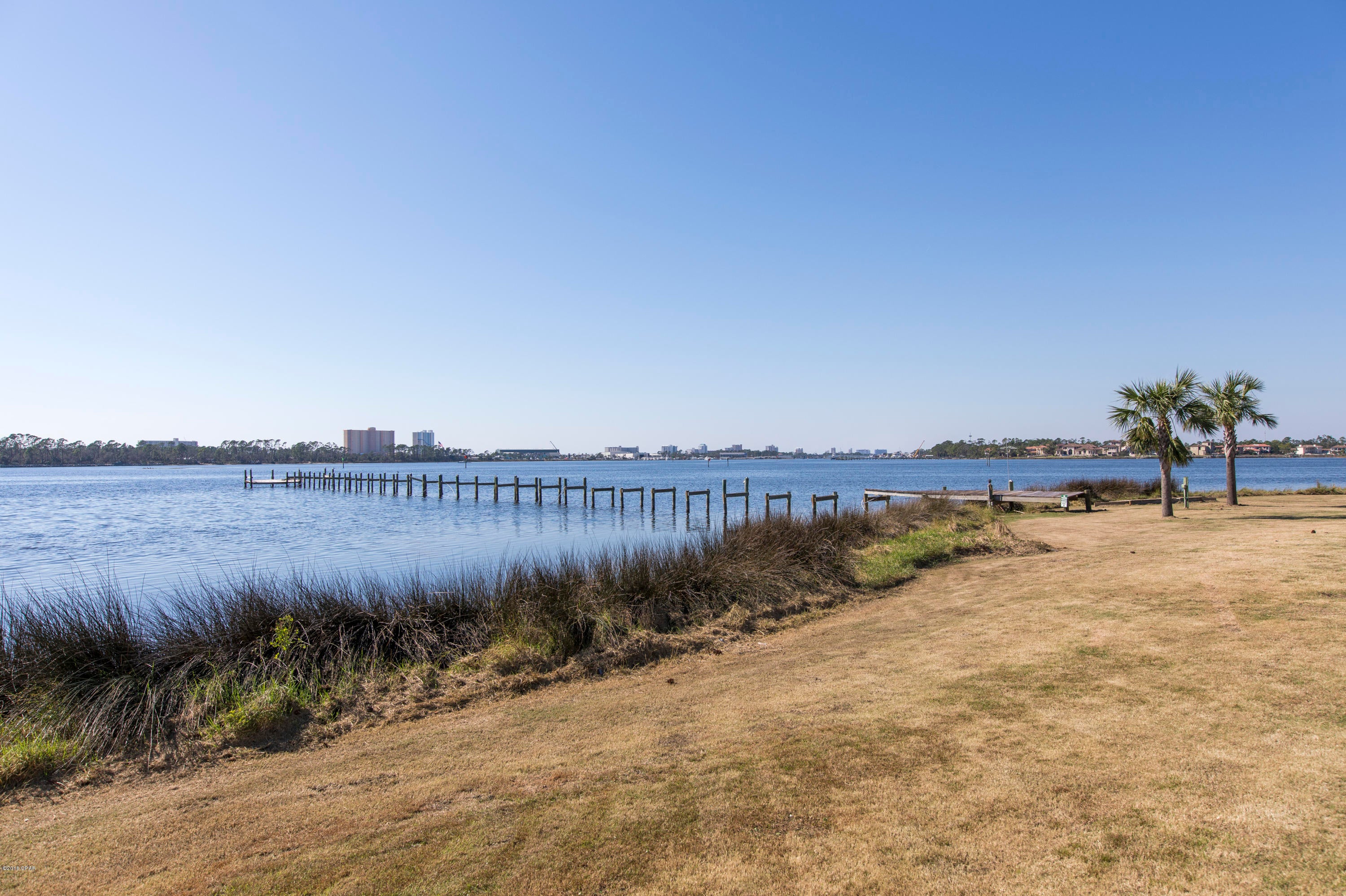 Bay View Villas is an extremely desired complex in Bay Point. There are so many wonderful benefits of this specific condo. It is extremely rare to offer ground floor units. This unit was not damage during Hurricane Michael. It has truly breathtaking, panoramic Bay views and view of the St. Andrews State Park. This bright, crisp 2 bedroom/ 2 bath villa is the perfect sanctuary to be able sit on the patio and take in the day. Bay View Villas has a boat dock so you can load up your family and friends on the boat and head to the island for the day. There are also a few marinas are right across the Bay for you to store your boat or you can get a slip at Bay Point Marina. It is a boater's dream. Don't miss this amazing opportunity and all it has to offer. It truly is a gem!