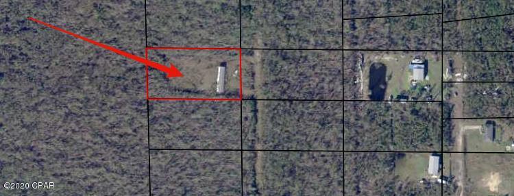 This is an ideal lot to build a home or place a mobile home on your own acre of land.  This parcel is primarily flood zone X where the mobile home is located surrounded by zone A.  (See photo)  There were utilities to the mobile home prior to Hurricane Michael.  Owner selling ''as is''.
