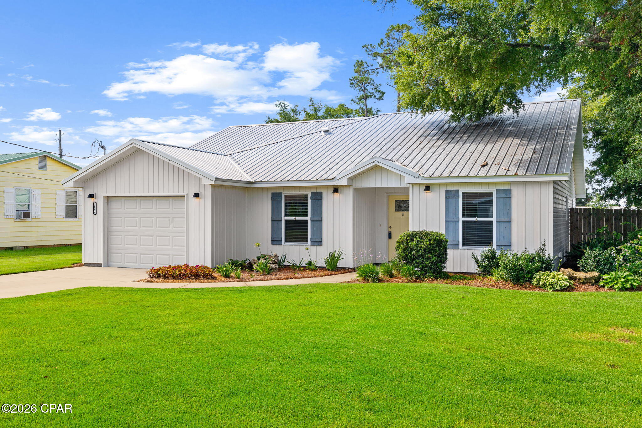 Lovely newer home in central location within short distance to Historic Downtown District,  Charming St. Andrews, the Government HUB of Panama City, Great Restaurants and Entertainment Venues. The exterior features  Board and Batten Siding with Coastal Style Shutters. Beautiful Professional Landscaping with a Privacy Fenced Back Yard. A covered entrance leads to an inviting Open Floor Plan featuring 9 ft ceilings and 10 ft decorative trays, maximizing the square footage! A Spacious Modern Kitchen with loads of storage, features Stainless Appliances and White Quartz Countertops. The Living Area Opens to a Screened Porch to enjoy Florida Living Year Round! Come take a look and love where you live!