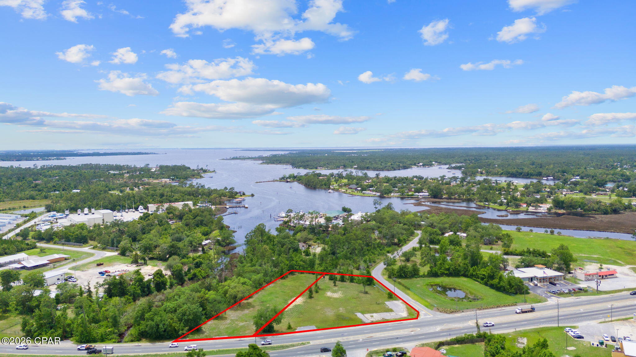 ±1.95 acres of C3-zoned commercial land located along the highly trafficked Highway 77 corridor in Southport. This offering includes two contiguous parcels totaling approximately 300 feet of frontage and exposure to an estimated 29,000 vehicles per day.

The site features a corner parcel with established ingress and egress, providing strong accessibility and visibility, along with an adjacent interior parcel that enhances overall site layout and development flexibility. The combined configuration allows for a more efficient footprint compared to individual acquisition.

Preliminary development work has been completed on the interior parcel, including survey and conceptual planning, offering insight into site potential. Ideal for auto-oriented, retail, or quick-service commercial uses seeking high-traffic exposure.

Available individually or in combination with the adjacent corner parcel for expanded development opportunity.