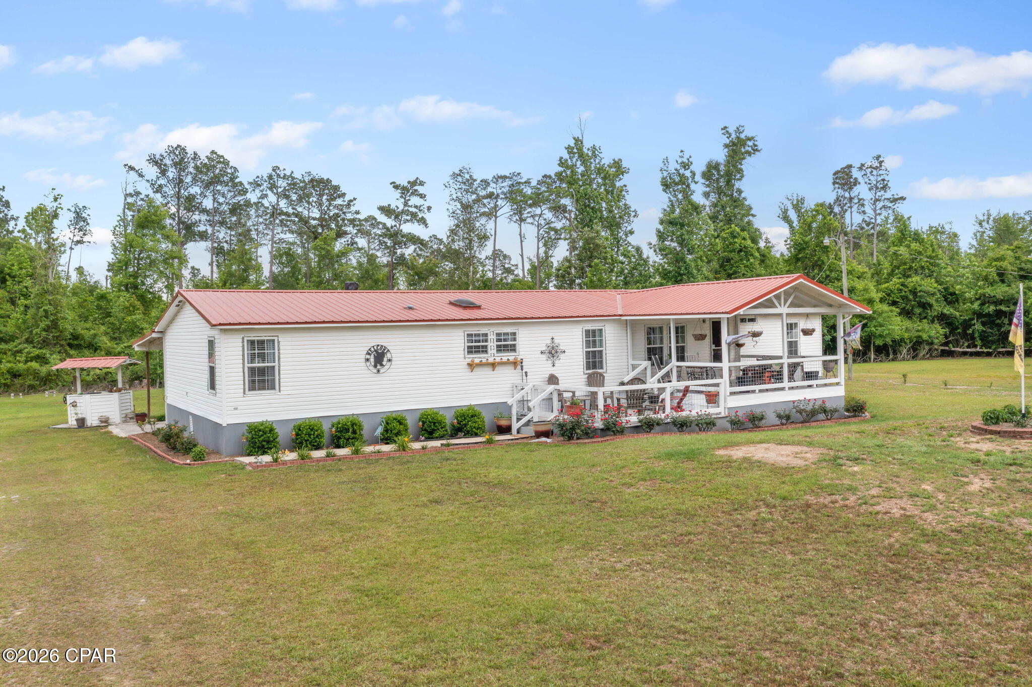 Country living at its best!! Move-in ready 4-bed, 2-bath DWMH on 2.8 acres.  Bright, open-concept layout with a split floor plan: spacious living room flowing to the dining area, plus a large family room with a fireplace opening to the kitchen. The kitchen offers abundant cabinetry, an eat-in bar and new appliances. The primary suite includes an oversized adjoining room perfect for an office or nursery but is currently being used as a walk-in closet.  Master bathroom features double sink vanity, shower complete with separate soaking tub.

Recent updates and upgrades: newer roof, fresh interior paint, updated lighting, new floor coverings throughout, remodeled bathrooms, replaced windows, and a new heat & air unit -- all done for comfort and low maintenance. Exterior features include a workshop with electricity, above ground pool, single car carport and a covered front porch perfect for relaxing!  

All of this and so much more! Don't miss out on this gem, call today to schedule your personal viewing.