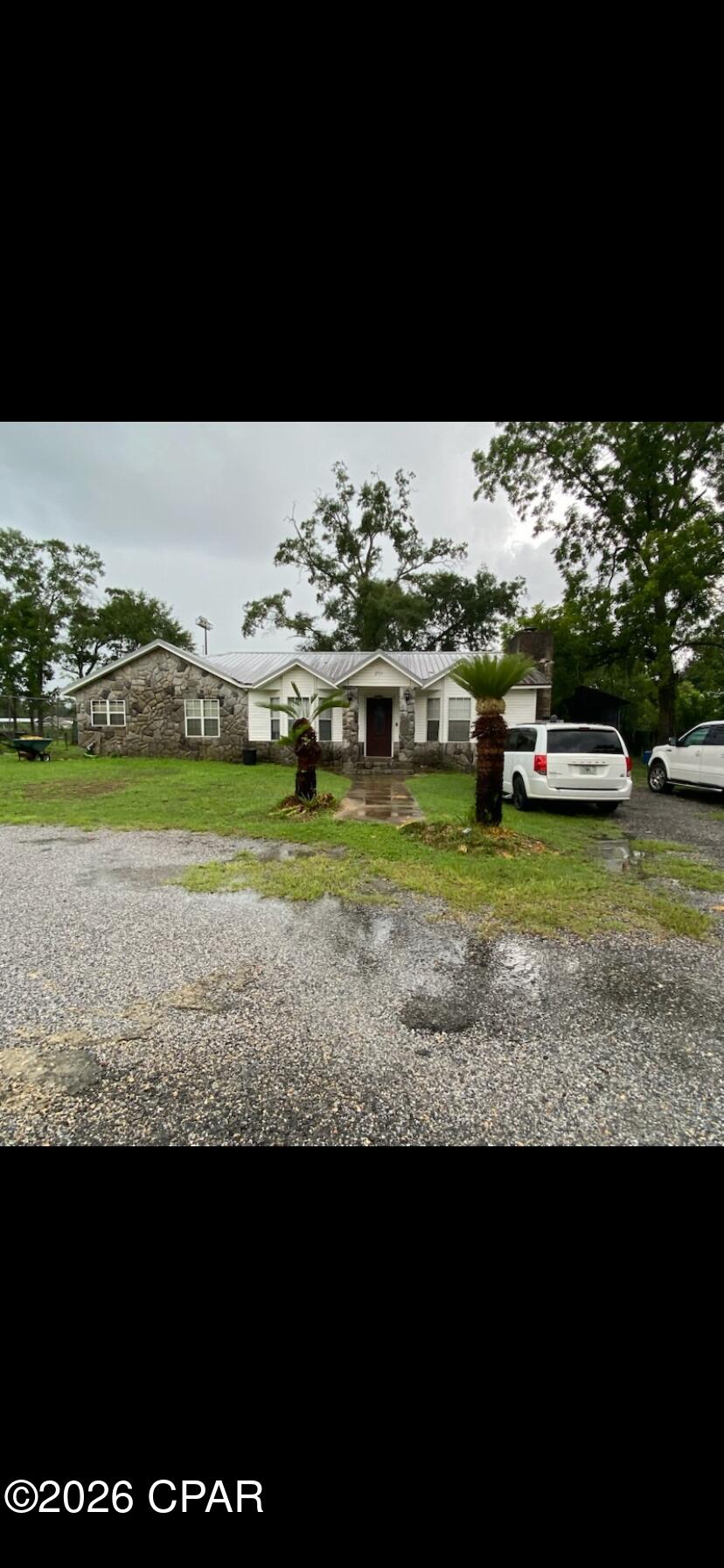 Charming 3-bedroom, 2 bath home in the heart of Cottondale Fl.  Steps from the schools
Property consists of several lots in the city.  Home has a beautiful rock fireplace.  All stainless Steel appliances.  Metal roof and a huge pole barn. Back part of property faces Cottondale High School football field.  Watch all the games from your own backyard!