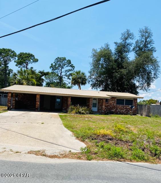 Canal Front 3BR/2B Brick home with seawall and boat lift.  This home has 1,847 SF (H&C) and has been updated with new flooring, kitchen, stone counters, crown molding and paint. Partially fenced yard.  Screen Porch on back of home.  Easy access by to St Andrews Bay and Gulf of Mexico from the back yard canal. Perfect spot for the fishing enthusiast. Restaurants, schools, shopping nearby.