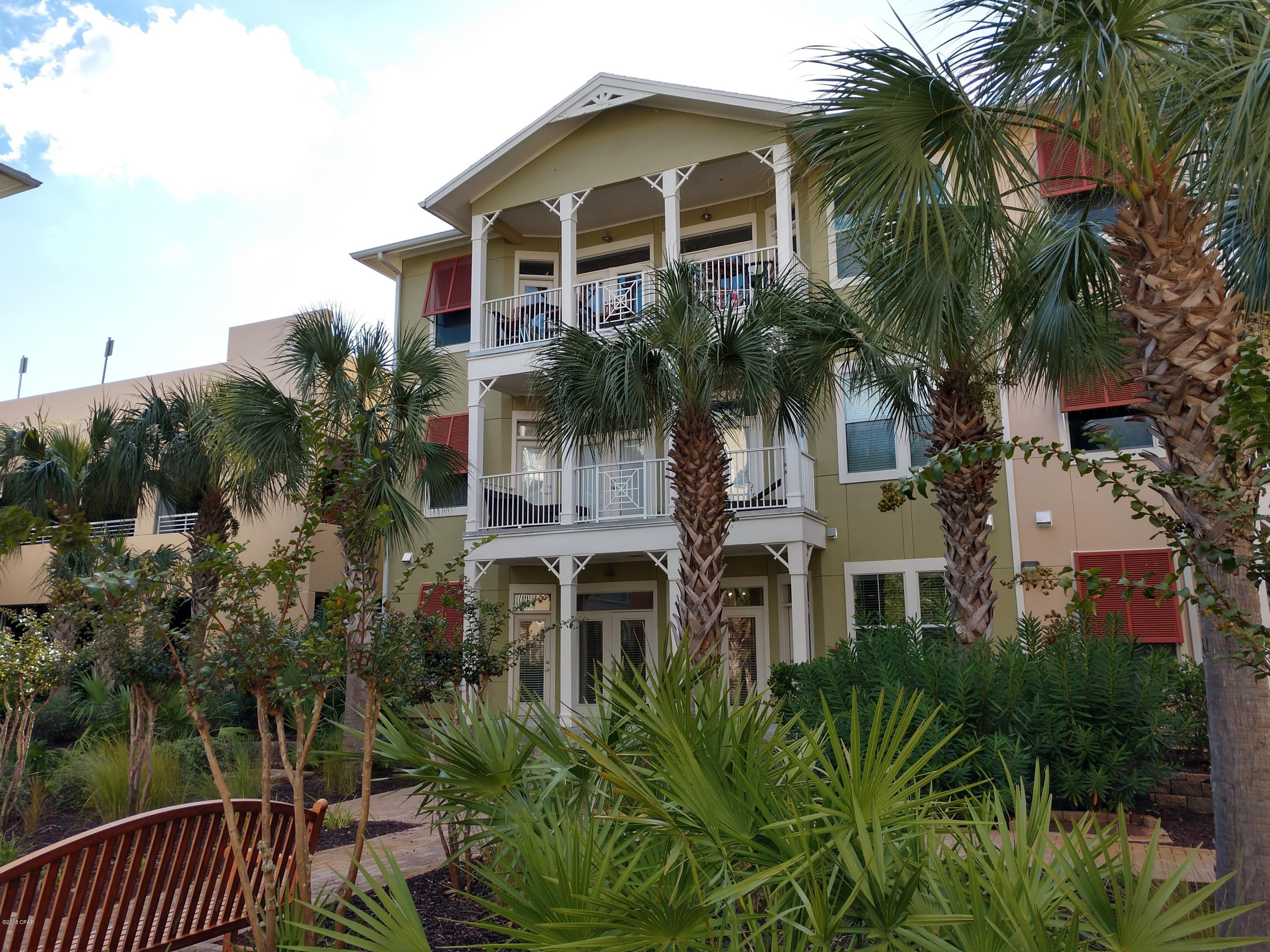 No hurricane damage in this 2 bed 2.5 bath condo in Island Reserve. NEW paint and carpet throughout. NEW HVAC in 2018. This gated community is truly an oasis at the beach, with great amenities; resort style lagoon pool w/ lap area, zero entry, and waterfall. Indoor basketball court, fitness center, game room and theater. Low HOA fees include water, sewer, garbage, landscaping, amenities, security. This condo boasts 10-foot ceilings, crown molding, bamboo and tile floors in the open living/dining/kitchen. Huge private patio! Granite counters and island, under cabinet lighting, disposal, and GE stainless steel appliance package w/fridge, stove/oven, microwave, dishwasher. Full size washer and dryer included. Great as a primary residence, vacation getaway or rental unit. This is a ground floor condo. Next to the covered parking garage with covered entry to condo. Unit 1102 has been a long term rental since new. This property has been grossing over $16000/year and stays rented easily. Furnished 2 bedrooms can gross $18000+ annually. Island Reserve is highly sought-after for long term leasing and this floor plan is the preferred plan. This condo is in the perfect location; close to the beaches, close to the military bases, close to Pier Park, close to Panama City. Shopping, eating, and entertainment are all around you here. Island Reserve is an Oasis at the Beach!