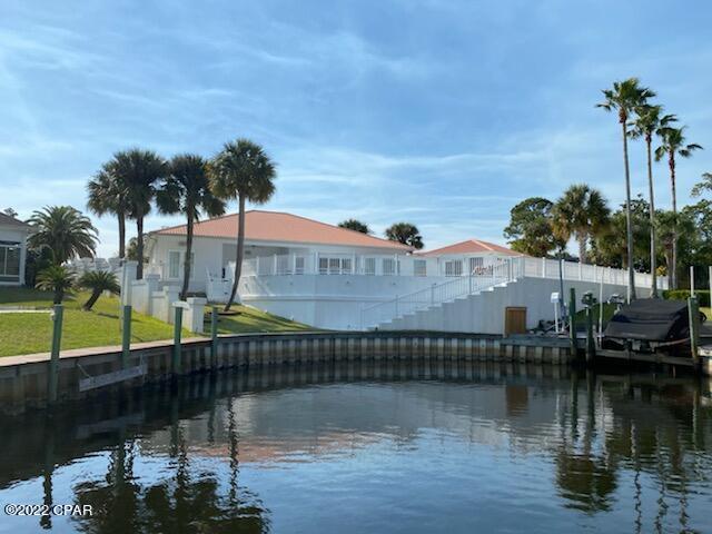 Amazing!! Canal front home snuggled in Bay Point gated community.   4 Bedroom 3.5 Bath, large pool, mother-in-law suite and 2 car garage, circular driveway with plenty of parking.  This Amazing home has it all.  Walk into spacious  open floor plan.  Kitchen with large counter/bar, lots of cabinet space, fully equipped.  Dining , den area , living room w/fireplace all have pool/canal view.   Master bedroom has fireplace, large closet and separate office area .  Master bathroom has tile Shower and double vanities.  Additional bedrooms with Jack and Jill bath.  Mother-in-law suite has large living space, full bath, closets, counter/shelving. Pool area is great for entertaining. Boat lovers dream home. From this canal there are no bridges to go under. So much to offer, a must see.  All Dimensions are approx.
