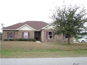 This beautiful brick and vinyl home has an open floor plan with a large living area and kitchen with an adjoining dining area. New carpet in living area & hall! The home has nice details such as tray ceilings, nickel lighting, larger master bath, his and her closets and dual vanities. It has a laundry room and a two car attached garage. Approximately the same distance to commute to Tyndall Air Force Base or NSA and close to Lynn Haven!