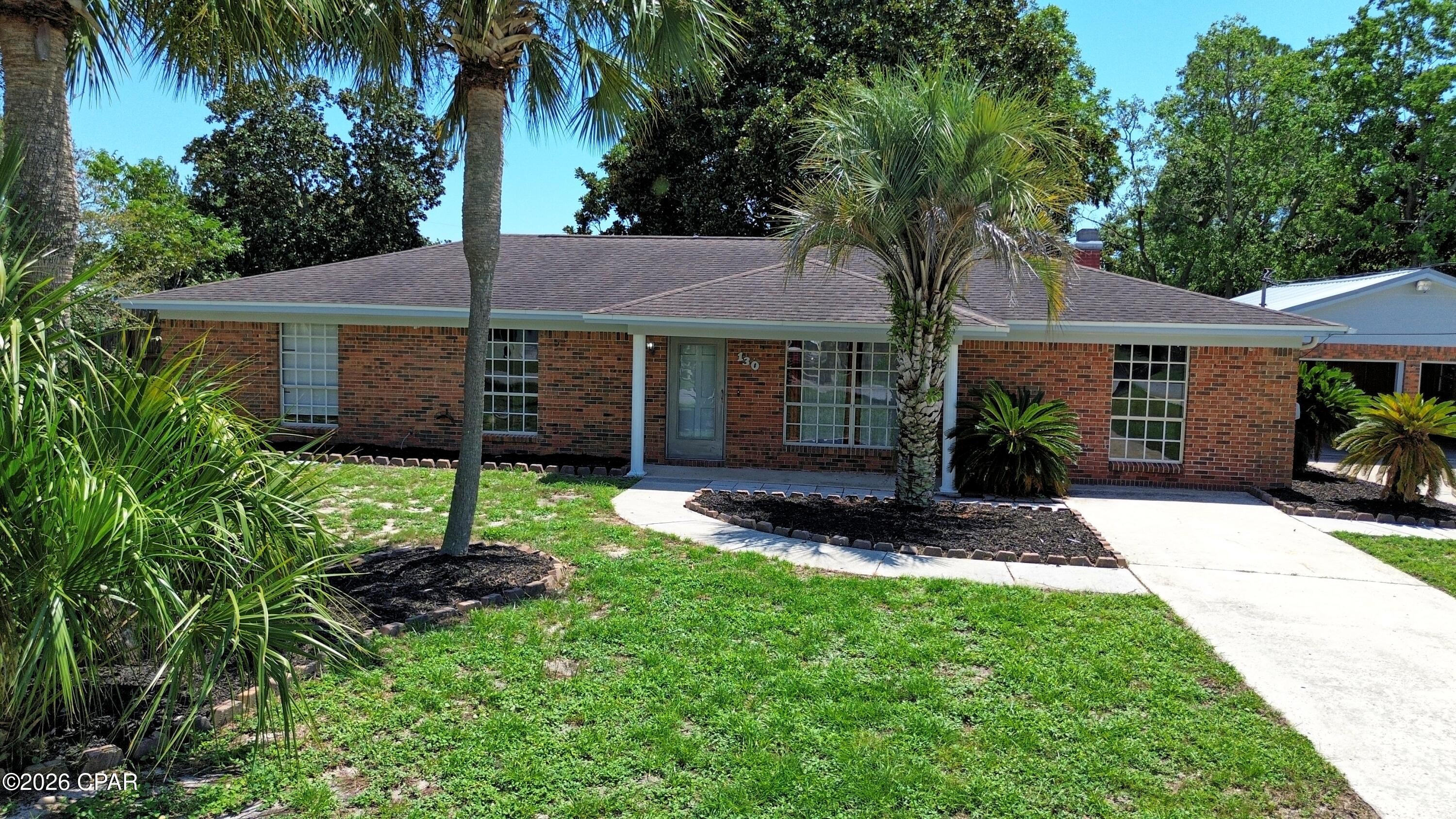 Welcome to 130 Heather Drive in Panama City Beach, FL 32413.

Owner financing is being offered with owner approved credit,25 years, 10% downpayment, 6.75% fixed rate. 

This well-maintained 3-bedroom, 3-full baths brick home offers generous living area, a versatile floor plan, and exceptional parking and storage.Mature palm trees and established landscaping create a warm Florida welcome from the moment you arrive. 
Inside you will find a spacious kitchen featuring abundant cabinetry and expansive counter space- perfect for everyday living or entertaining family and friends. The kitchen flows seamlessly into a bright sunroom filled with natural light,creating the perfect spot to relax with your morning coffee or enjoy an afternoon with a good book.
A separate bonus room provides endless possibilities and can easily serve as a home office, hobby space, media room, playroom, additional family room or add a closet and you will have a 4th bedroom. 
Built with durable brick construction the home features generous size rooms and multiple living areas offering comfort and flexibility. A charming covered breezeway connects the home to the detached two-car garage, providing convenience while adding character to the property. 
Outside you will appreciate the attached two-car garage, an additional detached  two-car carport, a spacious driveway with ample parking and mature landscaping that enhances the home's timeless Florida appeal. 
Whether you're searching for a primary residence, a vacation getaway or an investment opportunity, 130:Heather Drive offers the space, functionality and potential to make it your own. 
In addition the covered carport could be converted into a guest house or mother-in-law-suite for multi family living. 
Schedule your private showing and discover everything this Panama City Beach home has to offer. 

It is the responsibility of the buyer or buyers agent to verify all measurements.