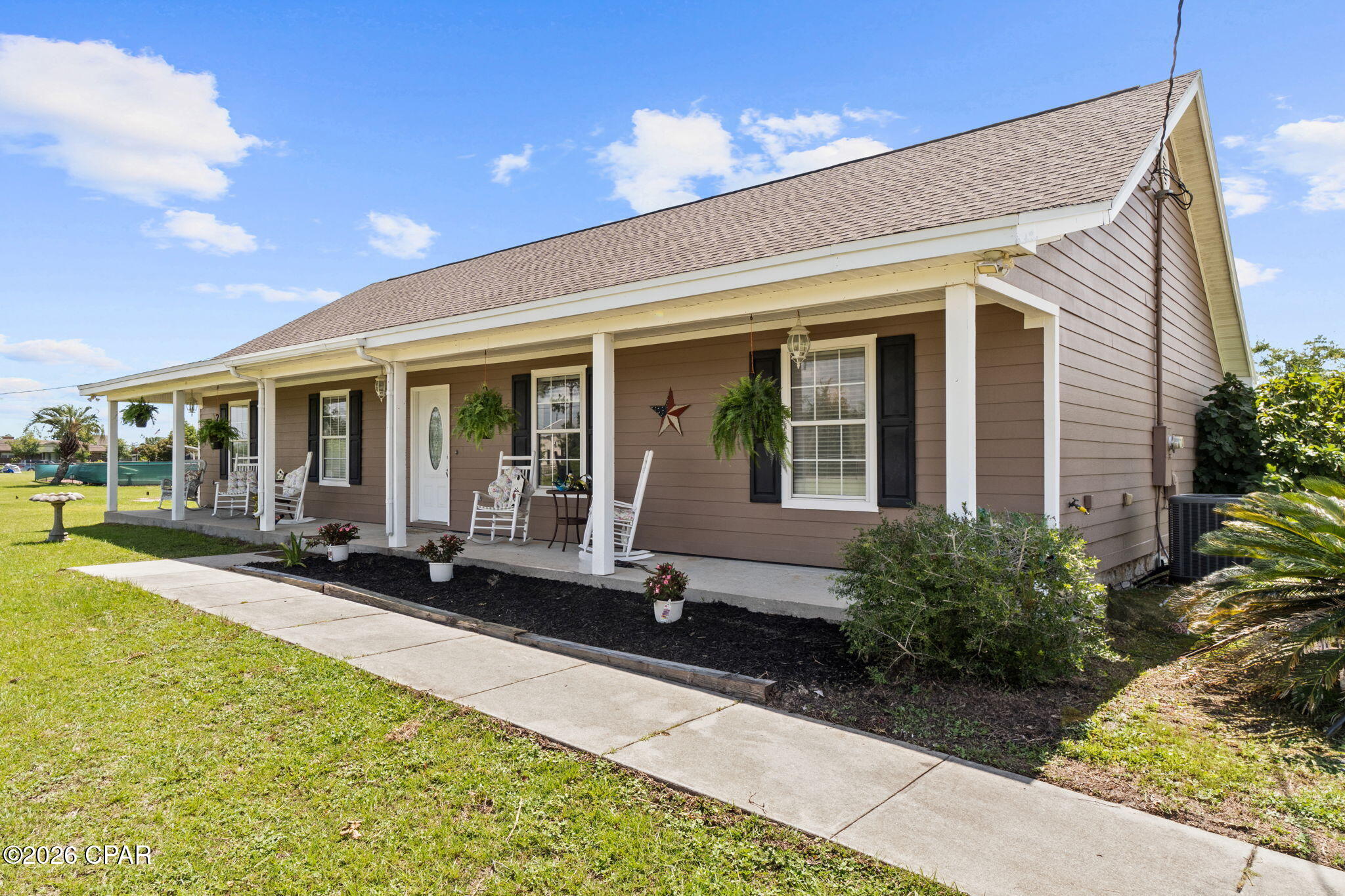 Country Living Awaits on 1.2 Acres in Panama City!
Looking for room to breathe? This spacious 4 bedroom, 2 bath ranch home offers 1,856 square feet of living space, set on 1.2 acres in the middle of a dead-end street. It's the peaceful, rural setting buyers are searching for, while still keeping you an easy drive from everything Panama City has to offer.
Grab a cup of coffee and settle into a rocking chair on the front porch -- it's the kind of spot you'll actually use. Step inside to a bright, open living space with vaulted ceilings and a cozy stacked-stone fireplace that anchors the room, with warm wood-look flooring flowing throughout the main living areas.
The kitchen is a real showstopper with it's rich wood cabinetry, spacious counters, stainless steel appliances, a breakfast bar, and an eat-in dining area, giving you plenty of room to cook, gather, and hang out.
The spacious primary suite offers a tray ceiling and a private, spa-like bath with a jetted garden tub, separate tiled walk-in shower, and dual-sink vanity - perfect for soaking away the day. Three additional bedrooms provide flexibility for family, guests, or a home office, plus a second full bath to round things out.
Out back, unwind on the large screened-in porch overlooking the expansive backyard -- ideal for entertaining, relaxing, or just enjoying the space and privacy this lot provides. A storage shed conveys with the property for extra storage.
Major systems are already taken care of -- the roof was replaced in December 2018, and a high-efficiency heat pump was installed in 2023, giving buyers peace of mind and one less thing to worry about.
With its rural setting, generous acreage, and move-in ready interior, this home is a rare find. Come see it for yourself -- schedule your private showing today!

1,856 SF | 4 Bed | 2 Bath | 1.2 Acres | Screened Porch | Dead-End Street | Roof 2018 | HVAC 2023