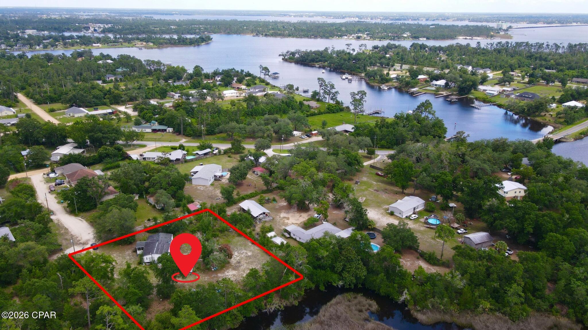 Discover a rare opportunity to build your dream home in one of Southport's most scenic waterfront settings. Nestled along the edge of a peaceful tidal creek that winds through natural marshlands before opening into the bay, this spacious homesite offers a unique blend of privacy, nature, and coastal living. Mature trees and native vegetation create a tranquil backdrop, while the surrounding waterways provide a picturesque setting filled with abundant wildlife, kayaking opportunities, and breathtaking Florida sunsets.

Located just moments from the open waters of North Bay, boating, fishing, and waterfront recreation are part of everyday life. Whether you're heading out for a day on the water, casting a line, or simply enjoying the serene views, this property offers the ideal foundation for a relaxed coastal lifestyle. The surrounding area features a mix of estate-sized homes, waterfront properties, and quiet residential streets that preserve the laid-back charm Southport is known for.

Conveniently situated near Panama City, Panama City Beach, and Northwest Florida Beaches International Airport, you'll enjoy easy access to shopping, dining, entertainment, and world-famous white sand beaches while still appreciating the peace and privacy of this hidden gem. Outdoor enthusiasts will love the proximity to local parks, boat ramps, nature preserves, and endless opportunities for exploring the waterways of Bay County.

If you've been searching for a homesite that offers natural beauty, waterfront surroundings, and room to create your own coastal retreat, 1125 Donald Penny Drive deserves a closer look. Bring your vision and start building the Florida lifestyle you've been dreaming about.