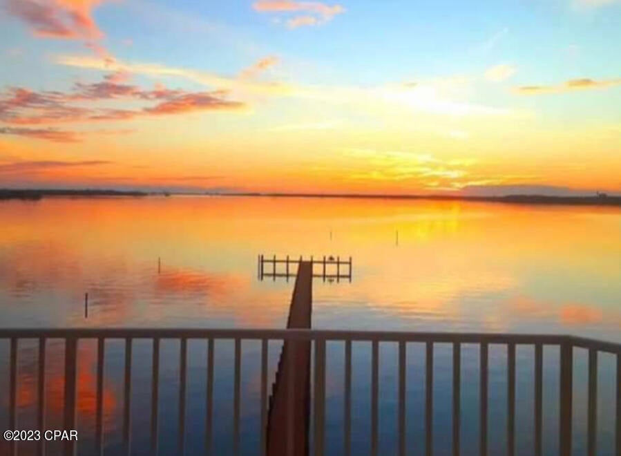 STUNNING WATERFRONT VIEWS! Check out the sunset from this beautiful balcony, the view doesn't get any better than this! Great 2-bedroom 2-bathroom Condo with phenomenal water views. Master bedroom suite faces the water, and offers fantastic water views, and large closets. The primary bathroom has two vanity sinks, a stand alone glass shower, separate whirlpool tub, and plenty of cabinet space. Slide back the balcony door and fall asleep to the sound of the waves crashing. This is one of only two units available in the highly desired Marina Bay Condos. The laundry room is very spacious. You can eat at the island in the kitchen or at the dinner table and still catch a beautiful waterfront view. The unit is located on the 2nd floor of this 8 story complex, so not too high or too low. The heated pool and hot tub also have a great view, as well as the large dock that goes out into the Bay with plenty of room to fish. There is a private little beach with a barbecue grill for a relaxing cookout. Call for more information today!