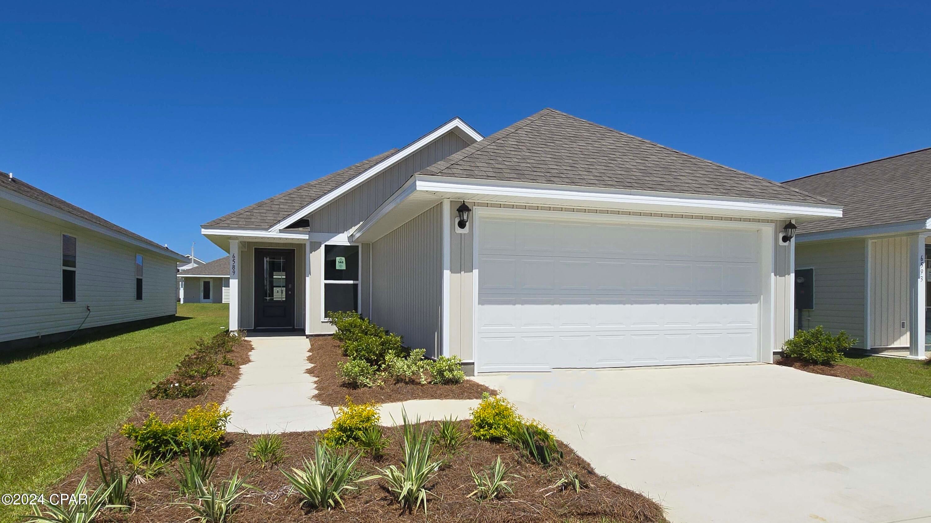 Welcome to Liberty. This home is ready for quick move in. This Celeste floor plan is located at 6589 Canley Court. Featuring 3-bedrooms, 2 full bathrooms, and 1427 square feet, this home has an open concept floor plan. Interior features of this home include EVP flooring in living and wet areas, granite countertops, stainless kitchen appliances which include a stove, microwave, and dishwasher. The kitchen features a breakfast bar area with room for seating. The primary bedroom is located at the back of the home and features a large closet with an ensuite bathroom with dual sink vanity and large shower. The laundry room and additional bedrooms are just off the living room. This home is a must see. Like all homes in Liberty, the Celeste includes a Home is Connected smart home technology package which allows you to control your home with your smart device while near or away. Liberty neighborhood is conveniently located in beautiful Panama City off Star Avenue near 231. Located just 25 minutes from Tyndall Airforce Base, 20 minutes to hospitals, and less than 15 minutes to shopping, restaurants, and grocery stores you will be amazed at the convenience once you enter the winding entrance to this beautiful sanctuary. Liberty, D.R. Horton's premier new lifestyle community, offers a 7,500 square foot community center with full gym, wellness rooms and much more. Additionally, behind the community center is a water wonderland with resort style pool, splash pads, and an outdoor grilling kitchen with seating.