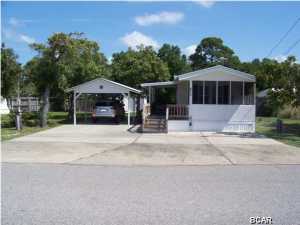 Well kept and very clean mobile home 2 minutes from the Worlds most beautiful beaches. Mobile home has 5 year old Metal Roof. Heating and cooling unit purchased 4 years ago and A/C compressor is under warranty. Insurance is through Citizen and is $1000 annually. No flood insurance needed. Sofa is a queen sleeper and mattress in Additional bedroom is new.