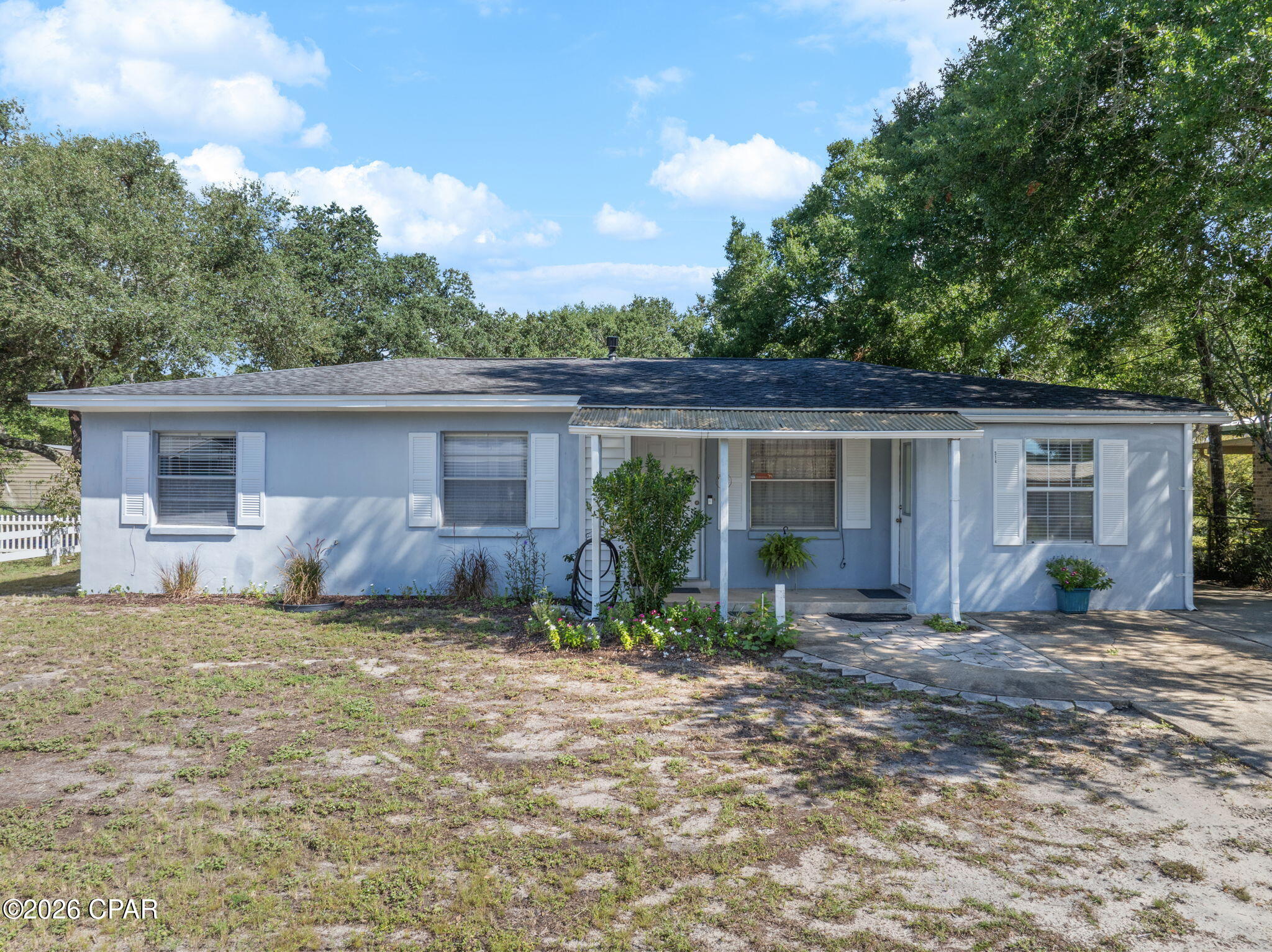Welcome home!
This charming Florida cottage is the perfect place to create your very own space. The flex room offers a 4th bedroom, casual living room, game room, craft room or whatever you can imagine!
Tucked away in an established Fort Walton Beach neighborhood, 514 Newcastle Drive has a warm, welcoming feel and the kind of charm that instantly feels like home. A coziness fills the spaces with a soft, airy feel, while the comfortable layout offers an easy backdrop for slow mornings, relaxing evenings, and everyday moments. With a spacious yard and a convenient location near shopping, dining, schools, military bases, and the beautiful Emerald Coast, this sweet home offers a peaceful place to settle in, make it your own, and create lasting memories.
The roof was replaced in 2018, new electrical wiring and new plumbing all installed in 2018.  There is a large wooden shed and a large metal shed in great condition, both with electricity. The back yard is fenced in with chain-link and has irrigation with a pump and well.
Two of the three sheds will convey with the property!