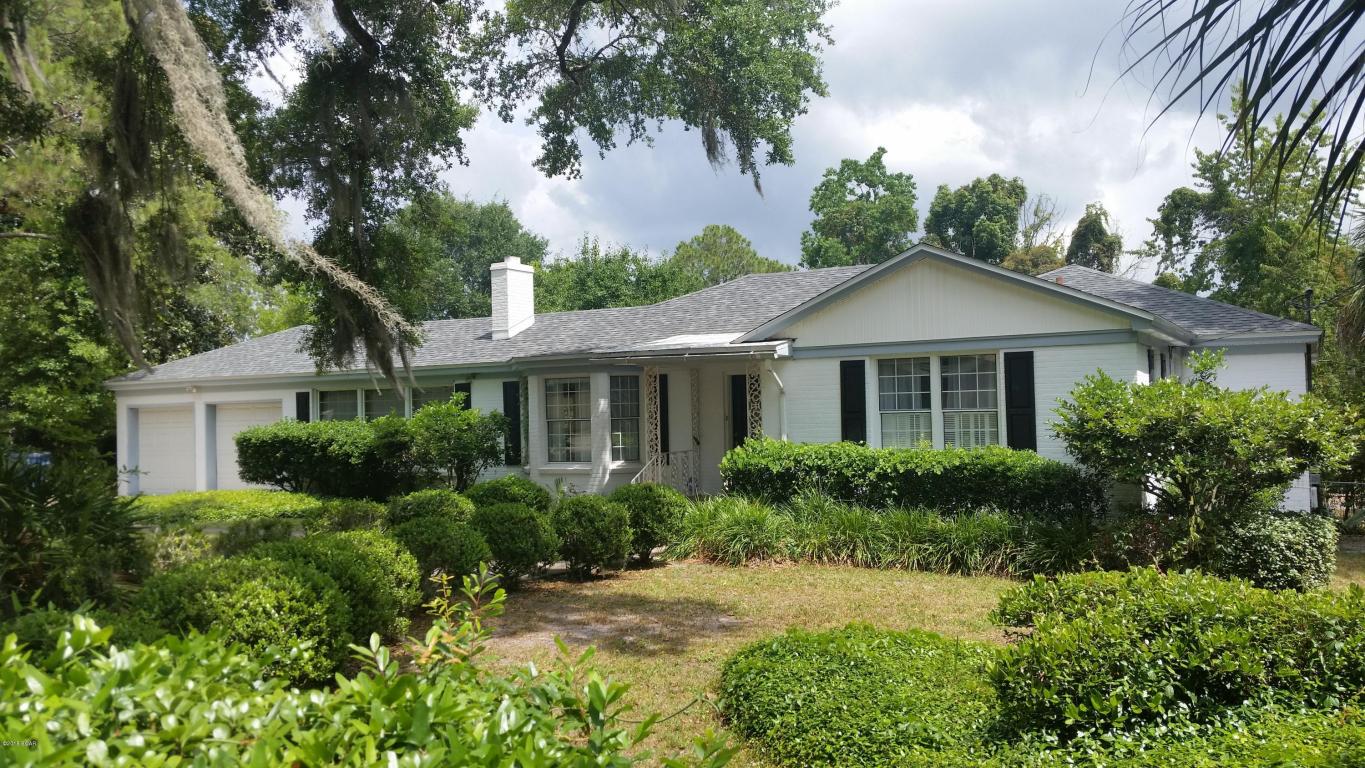 What exactly does Cove Classic mean? In this case it means a gracious and well-built home in the heart of the Cove. Built by a local contractor for his family this home has only had one owner. NEW ROOF June 2015. The exterior is all brick with mature landscaping of the spacious lot. Large screened patio would be perfect for your new ''summer'' kitchen. The interior features lovely original hardwood floors(Birch!) and charming custom finishes. The dining room has built in corner cabinets and lots of light. The living room features cabinets on both sides of the fireplace, built in bookshelves and a bay window. The family room is beautifully paneled with built in bookcase, crown molding and a true lighted tray ceiling.