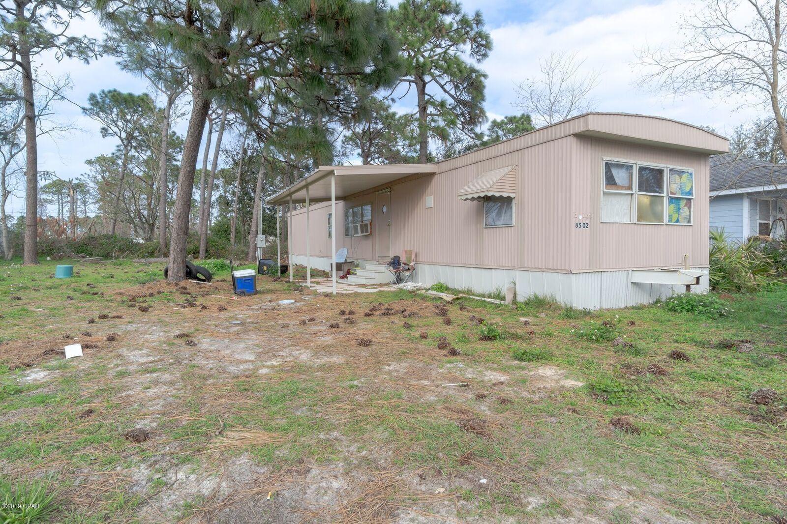 This is a hurricane damaged trailer located on Panama City Beach. The trailer can be repaired but is being sold AS-IS today. Won't last 3 Bedroom 1 bath 720 sq ft. This sits on a 75x118' lot. Septic tank works. Your only limitation is your imagination