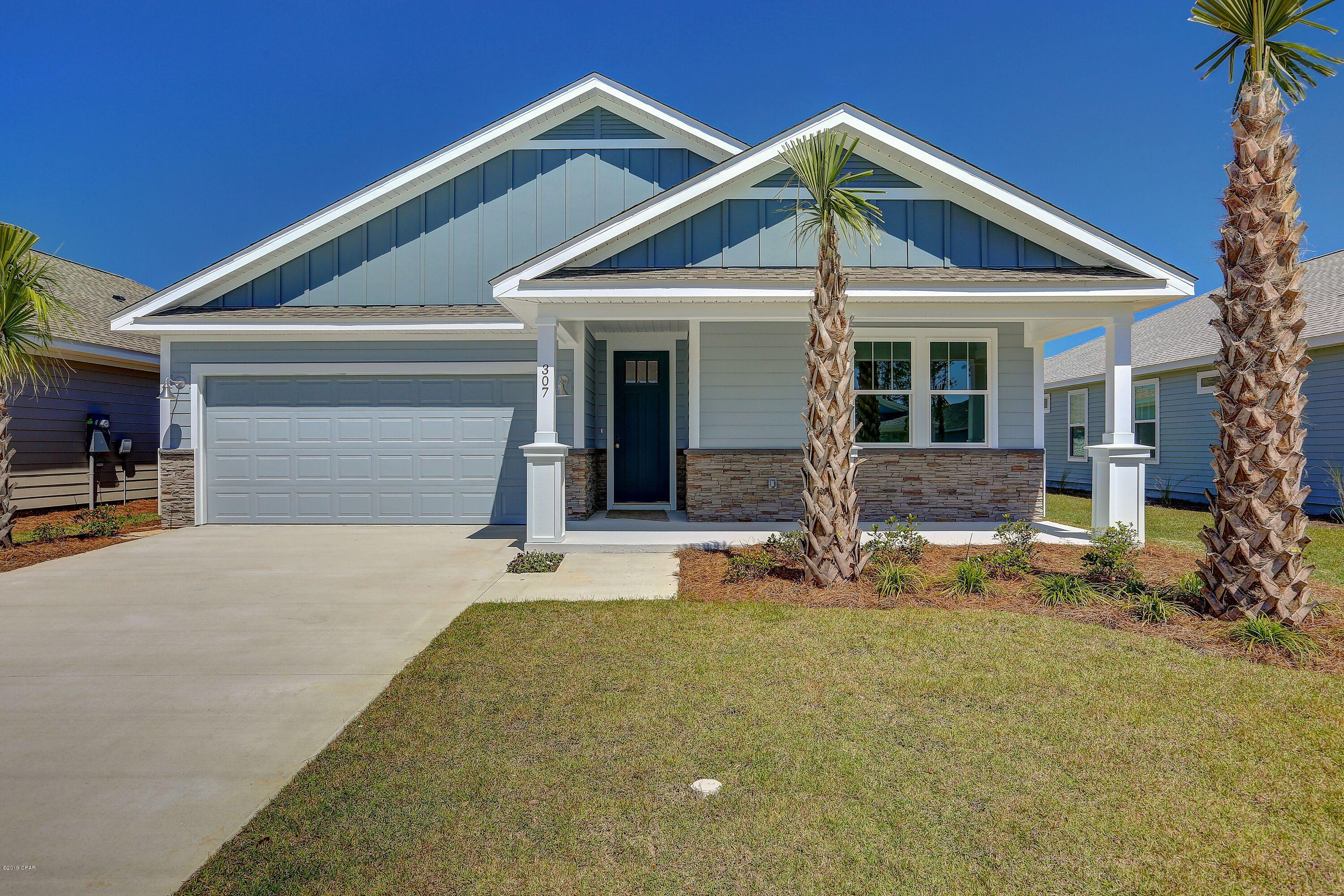 NEW CONSTRUCTION SHEARWATER GOLD 3/2-located in Panama City Beach's desired Breakfast Point subdivision built by Southern Coastal Homes-Offering quick easy access to TAFB, the white sandy beaches of the Gulf of Mexico, Publix anchored shopping center, Breakfast Point Academy-Rated A (walking distance)and the famous Pier Park. INTERIOR features of this coastal inspired home offers a private grand Foyer entrance, large volume Great Room with an open floor plan, kitchen with 4 burner gas cooktop, center island, custom cabinetry with soft close drawers and stainless steel appliances, Master Suite with tray ceiling, expansive tiled shower, double vanity and large walk-in closet. Large covered patio just off Great Room makes this home perfect for entertaining. EXTERIOR-This SHEARWATER GOLD home features a 2 car garage, covered lanai, covered front porch, fully sodded yard with Rain Bird sprinkler system. This home includes all of the GOLD STANDARD FEATURES LIST and DESIGN BOARD with upgraded finishes including Luxury vinyl plank flooring, custom cabinets, granite solid surface counter tops, 50/50 stainless steel undermount sink, tiled back splash, Moen "Eva Style" plumbing fixtures, Whirlpool stainless steel "Gourmet Kitchen" appliances, stainless sink and much more. See the GOLD STANDARD FEATURES LIST, available DIAMOND ADDITION items and finish board in the document section of this listing. 
Gold Appliance Package Includes: 30" Chimney Hood in Stainless Steel: 4-Burner Gas Cooktop in Stainless Steel: Countertop Microwave with Trim Kit in Stainless Steel: Front-Control Dishwasher in Stainless Steel: 5.0 Cu. Ft. Single Wall Oven in Stainless Steel: