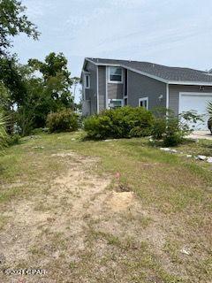 WATERFRONT views from the upstairs Master Bedroon, Master Bath, upstairs Hall and Living Room.  This home is located on Watson Bayou which leads to the Bay and out to the Gulf of Mexico.  It has been freshly painted inside, a new roof and new windows installed in 2019, all bathrooms have been completely redone as well as the kitchen with all new appliances.  The large side yard enables owners with a place to park a boat or RV with a sewer line available.  There is a large wrap around deck/porch to enjoy your waterfront views while having your morning coffee or after work relaxation time.  This home is MOVE-IN ready and is currently the ONLY home located on navigable water at this price.  Don't wait - check it out today.