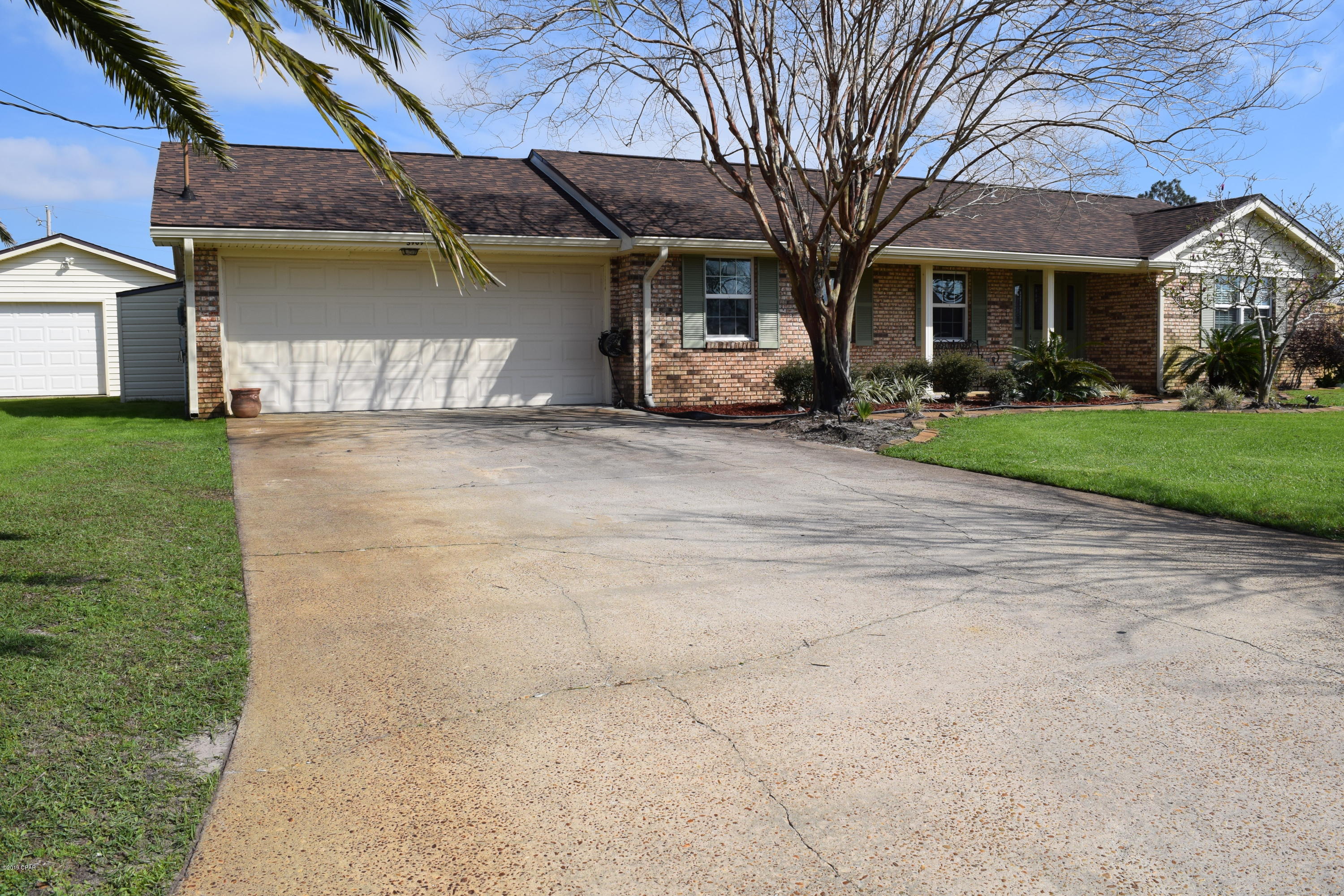 CURRENTLY UNDER CONTRACT, SELLER ACCEPTING BACKUP OFFERS. Brick home, turn key, ready to go!  This home is attractively updated featuring both a living room and family room with engineered laminate flooring in the main areas,  complimented by all neutral tile in the wet areas and entry . The foyer has a nice designer touch with leaded glass, creating a positive first impression.  The galley style kitchen is equipped with new appliances and has direct access to both a breakfast nook and dining area. All windows are Swinco impact windows, the garage door is also impact rated making it strong against windstorms and lowering the cost of insurance. A new dimensional shingle roof was installed per latest code updates post hurricane Michael with the double water barrier system. The air conditioning system is new too!  The home has a nice backyard with plenty of room, shallow well for irrigation,  open patio area, new privacy fence and a detached yard building that has plenty of room for a car and motorcycle or perhaps a boat!