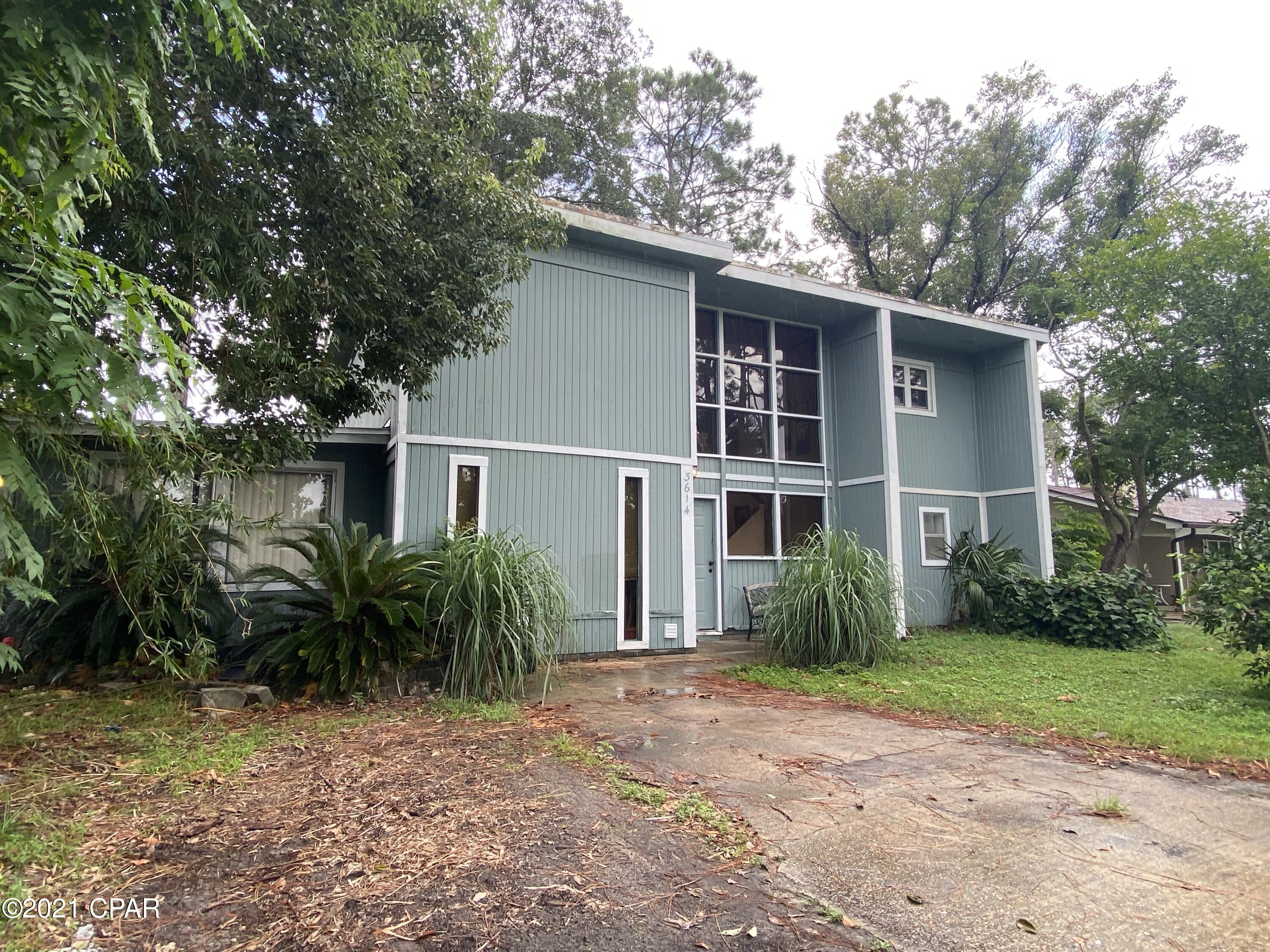 Very unique 3 bedroom 2 bath plus large family/ sunroom two-story house in great location just off North Lagoon dr. Upstairs living area features living room with fireplace, dining area, kitchen and master bedroom and bath with a deck off the living area. Two guest bedrooms and large family/ sunroom room is downstairs. Needs work, but has lots of potential! Large lot with matured pine and magnolia trees. Short-term rent allowed. No HOA. Flood zone X. Please verify all information and measurements if important.