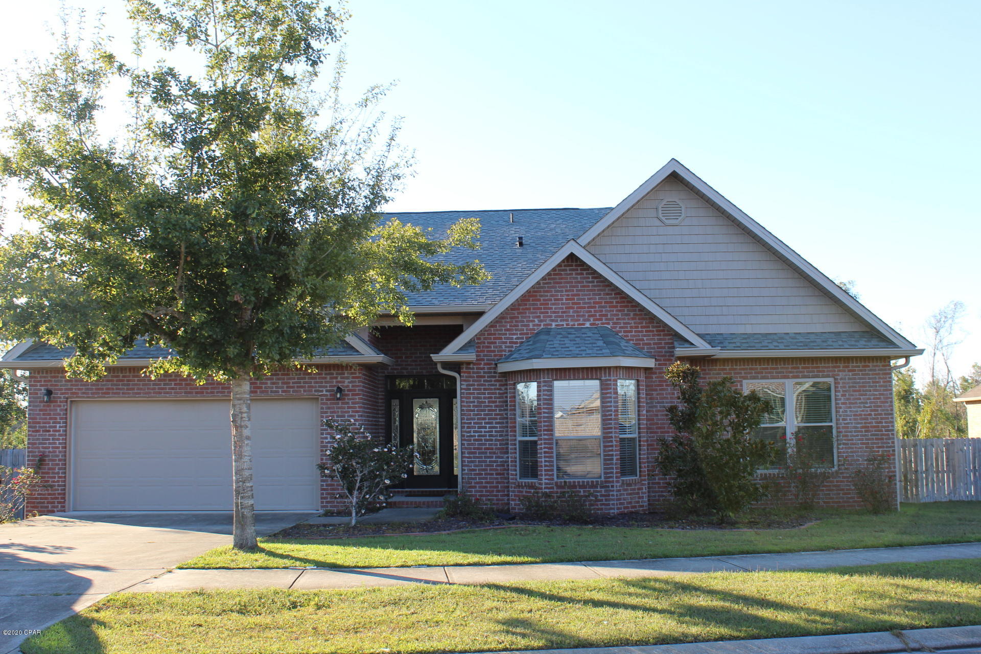 Lovely brick home with open floor plan located in Magnolia Hills subdivision.   Living room features electric fireplace and vaulted ceiling. Large eat in kitchen with granite counter tops, pantry. Both the dining room and master suite have trey ceiling and crown molding. Master bath has a double vanity, garden tub, separate shower and walk-in-closet. Large covered back porch overlooking spacious back yard. Storage building too.  Convenient to shopping, schools, Tyndall Air Force Base.