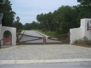 -Wonderful opportunity to live in a gated lake Powell community. This quite off the beaten path location is close to Rosemary Beach an Alys Beach. This large High and dry lakefront lot sits over looking beautiful pristine Lake Powell in a small gated Community. This community offers great amenities which include private pool, changing rooms, grilling area as well a community dock, no build out times. Buy to build now or invest in the future opportunity to enjoy this incredible area. TAP FEES PAID!! Survey available.