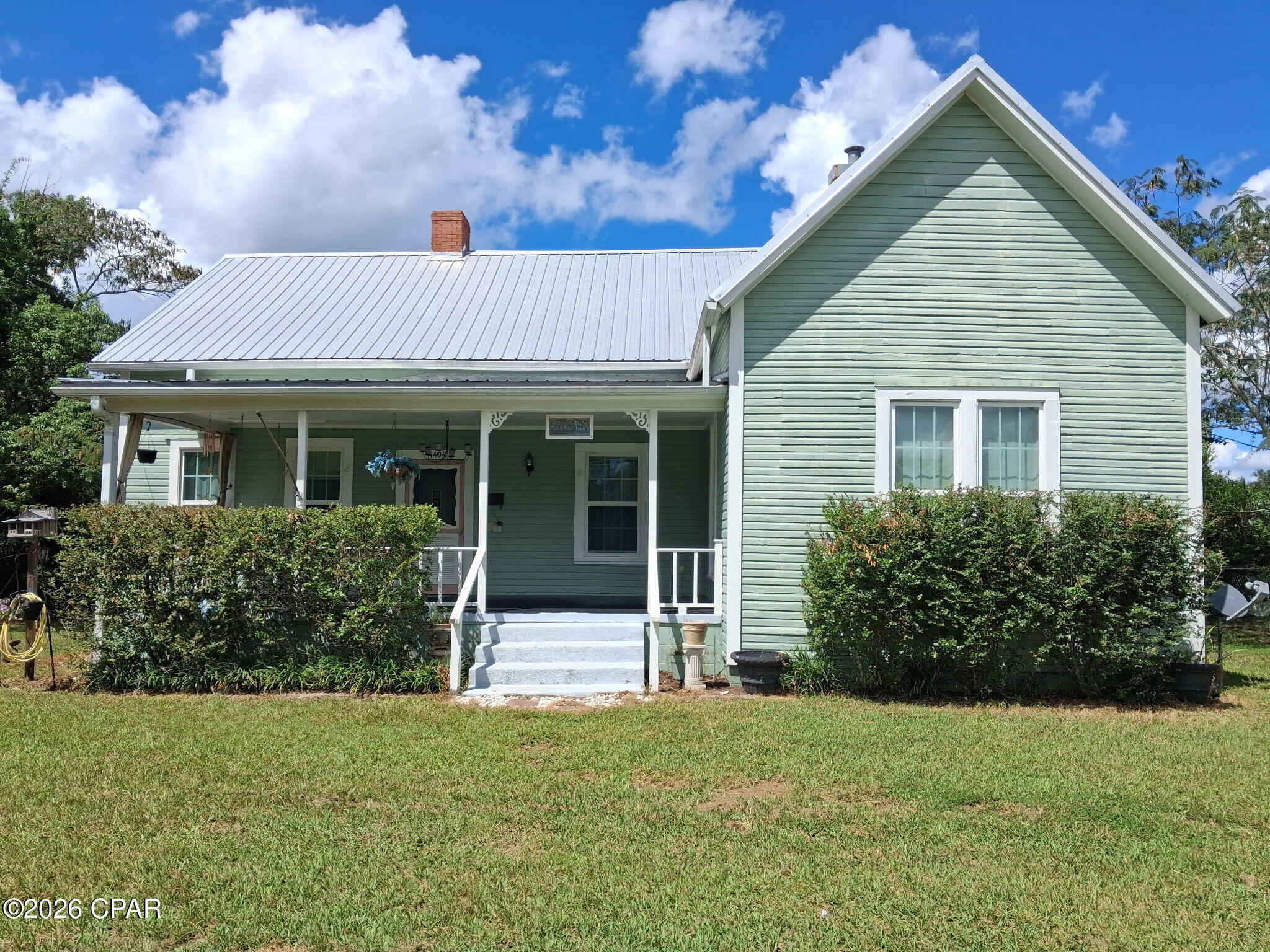 What a Gem , this historic home was build in 1925 and boost so much character. Even with a lot of updates, you still have some of the look and feel of the original home. What a great location too, and on a large corner lot. Fabulous front porch so you can enjoy the beautiful fall mornings or warm summer days. Back yard has a nice outside storage building and side yard has a cover carport. You can enjoy the big screened in back porch and huge back yard year around, with plenty of room for a swimming pool .Home has had new windows , new central heat/air , new metal roof all since 2018. This is a 3 bedroom and 1 bath home with endless possibilities. With its high ceilings, wooden floors and wood burning fireplaces. Home is registered as #35 on the Historical Homes tour in Jackson County. Marianna has so many beautiful Historical homes and historic places to visit. Call and come take a look around today .