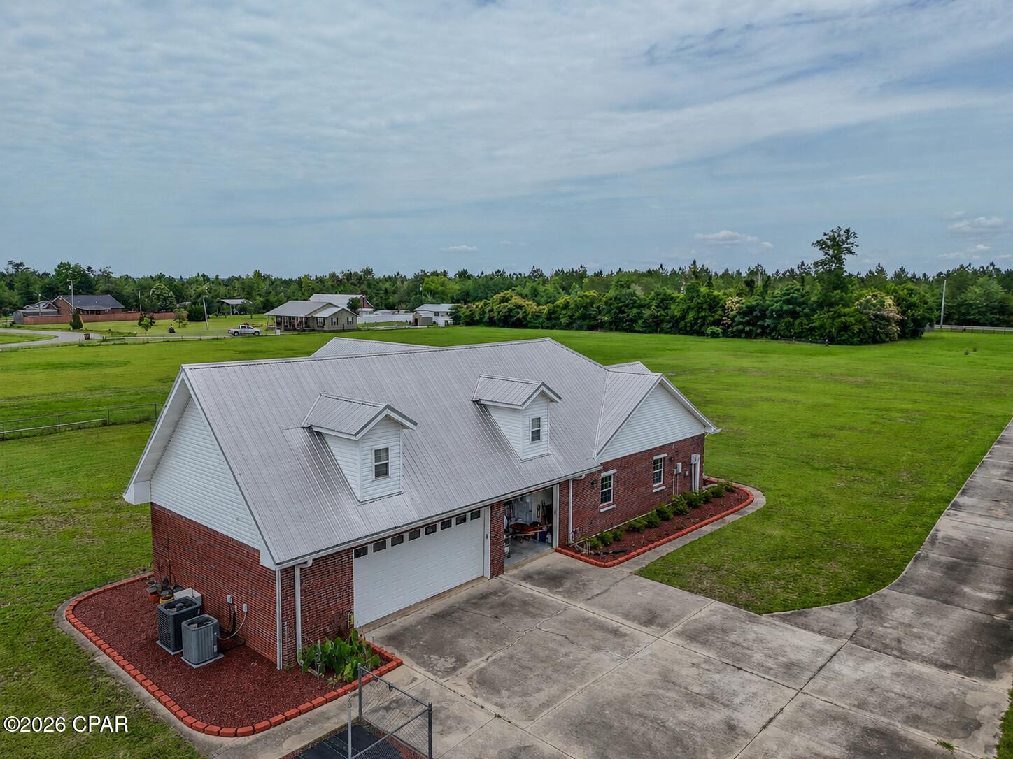 6.3 ACRES est. & MOVIE THEATER 
15189 NW Columbus Drive, Altha, FL 32421
Welcome to your own private slice of North Florida paradise! Situated on a spacious homesite, this beautifully maintained 4-bedroom, 2-bath home with a versatile bonus room offers the perfect blend of comfort, functionality, and country living.
Inside, you'll find a thoughtfully designed floor plan with generous living spaces, a well-appointed kitchen, and room for everyone to spread out. The bonus room provides endless possibilities--use it as a home office, playroom, media room, gym, or even a fifth bedroom to fit your needs.
Step outside and enjoy the peaceful surroundings, complete with an impressive collection of mature fruit trees that create your very own backyard orchard. The property features:
2 Southern Bartlett Pear Trees, 2 Florida King Peach Trees, 1 Meyer Lemon Tree, 2 Sunburst Tangerine Trees, 1 KieLime Tree, 1 Friendship Orange Tree.
The home's durable metal roof, expansive yard, and serene setting offer the ideal backdrop for enjoying outdoor living, gardening, entertaining, or simply soaking in the quiet country atmosphere. Whether you're looking for a family home, hobby farm potential, or a peaceful retreat away from the hustle and bustle, this property delivers.
Conveniently located in Altha while still offering the privacy and space you've been searching for, this one-of-a-kind property is ready for its next owner to enjoy.