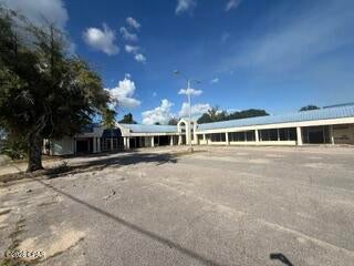 Rare value-add redevelopment opportunity with an existing 40,956 square foot retail property located on approximately 3.33 acres at the northeast corner of U.S. Highway 90 and State Road 276 in Marianna, Florida. The offering is priced at $750,000, equating to $18.31 per square foot, well below replacement cost and aligned with a land-driven investment basis. The property is currently vacant and the existing structure is not in operational condition, creating a clear value-add scenario with multiple paths forward.
For investors focused on redevelopment, the site's size, frontage, and corridor exposure support a range of commercial uses, including retail, service-oriented concepts, or convenience-driven formats, subject to approvals. For those exploring adaptive reuse, the existing improvements offer optionality, allowing a buyer to evaluate whether renovation or reconfiguration aligns with their business plan.
Positioned within an established retail corridor that includes national and regional tenancy, the location benefits from consistent traffic patterns and commercial activity. Marianna serves as a regional hub in the Florida Panhandle, approximately one hour northwest of Tallahassee, providing connectivity to surrounding markets while maintaining a stable local economic base.
Investment Highlights
Zoned Commercial
396± Ft Hwy Frontage
Great Visibility
17,900 Traffic Count
3 Curb Cuts
3.336 Acres
40,956 SF Shopping Center
Strong Demographics and Retail Area
Ingress/Egress from both bland and blank
Average HH Income $84,000, 5 Mile Radius
