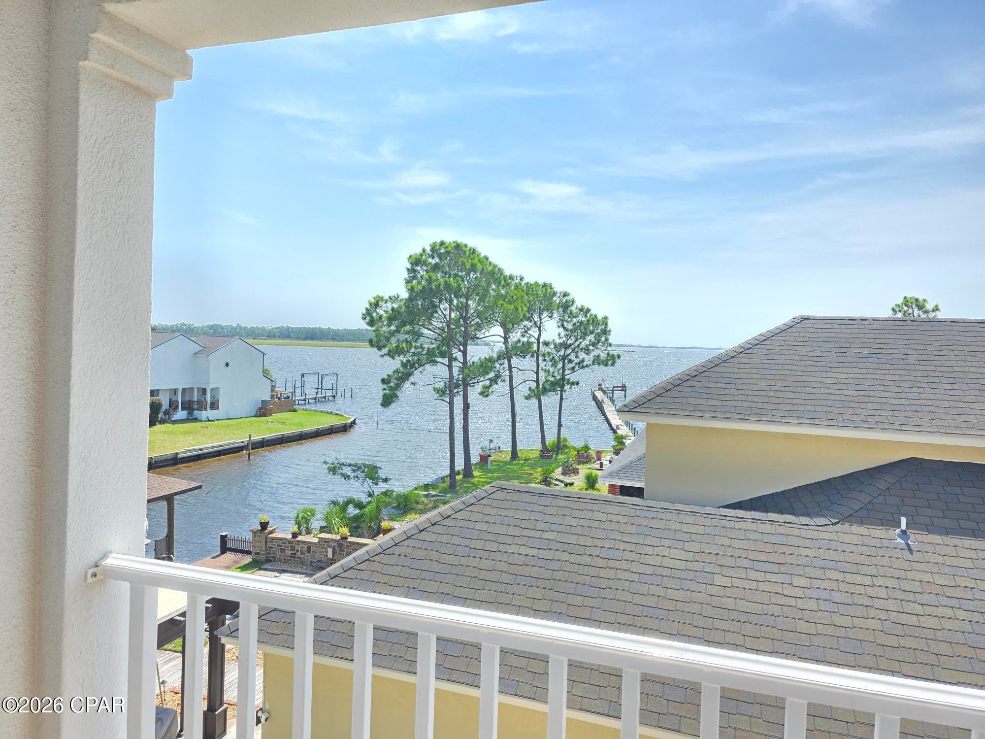 This is the one your adventurous side has been looking for...Canal Front leading out to Grand Lagoon, West Bay and the Gulf!! 
The seller has spared no expense renovating this amazing 4 bedroom, 4 bath, waterfront home!  From the beautiful wood floors, impressive cabinets, granite counter tops with a labor saving island sink, to the premium appliances (Miele dishwasher and washer/dryer, to the amazing, deluxe Cafe gas range utilizing 2 fuels with a convenient Pot Filler!!). This is the perfect kitchen for family gatherings!! 
Whether you are looking for ambient lighting, task lighting or accent lighting, this stunning home has all the classy features you could desire in the space you call home. All updates were well thought out using the best materials available...From the freshly painted, inviting exterior to the new eye catching decking!! Your Private Pool invites you to just relax and enjoy your surroundings while you are just steps away from your boat dock and the Open Water! You don't want to miss the BREATHTAKING SUNSETS ON THE LAGOON!!  This wonderful home features also include tankless hot water heater, new 2nd floor HV/AC, new  balconies, porch, AND deck flooring.   Square Footage includes decks and porches.  The roof was replaced in 2019. If you are in the market for a waterfront, THIS ONE IS A MUST SEE!
