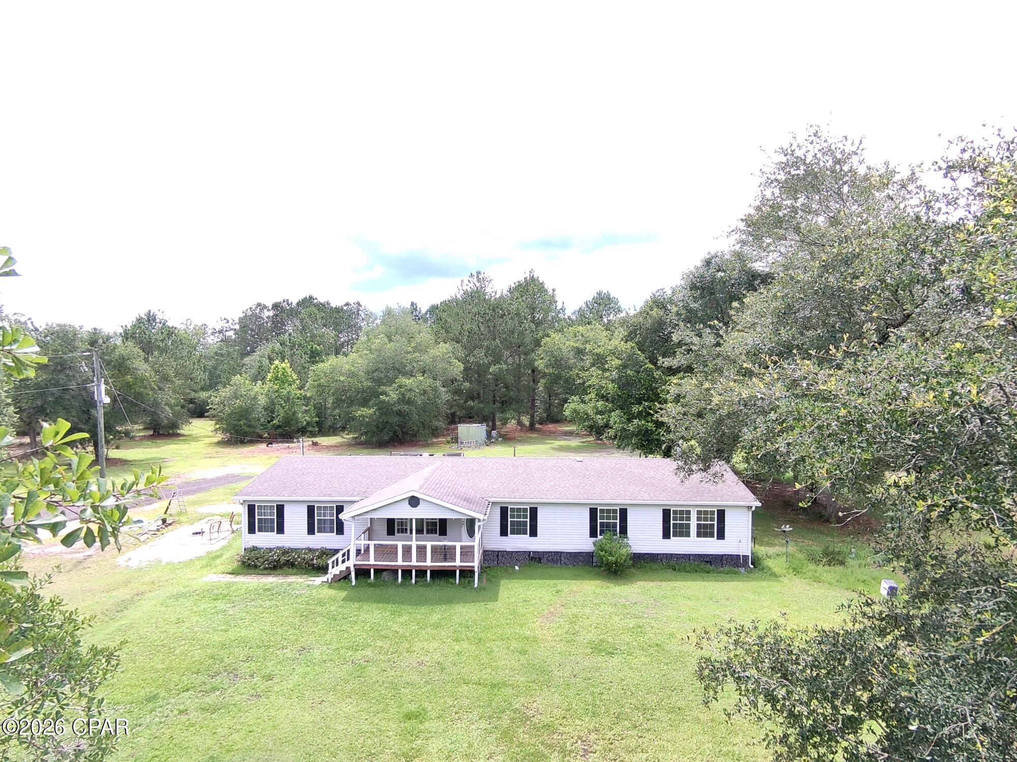 5.5-Acre Private Homestead with Ponds, Hunting & Unlimited Potential!

Escape the crowds and discover the peace and privacy you've been searching for in Vernon, Florida. Nestled on 5.5 unrestricted acres, this secluded country retreat features a spacious 2,280-square-foot, 2006-built doublewide mobile home offering 4 bedrooms and 2 full baths, making it ideal for families, homesteaders, hunters, or anyone seeking room to spread out and enjoy rural living.

Surrounded on all sides by neighboring large-acreage wooded tracts, this property provides an exceptional level of privacy rarely found. Two scenic ponds enhance the landscape, creating a beautiful setting for relaxing, fishing, wildlife viewing, or simply enjoying the peaceful sounds of nature from your own backyard.

Outdoor enthusiasts will appreciate the property's outstanding recreational opportunities. Deer and turkey are frequent visitors, making this an excellent hunting property right outside your back door. The mix of open space, water features, and surrounding timber creates ideal habitat for wildlife.

With no restrictions, the possibilities are endless. Bring your animals, start a hobby farm, create a self-sufficient homestead, park your RVs and equipment, or simply enjoy the freedom of country living without HOA rules or limitations.

Whether you're looking for a private family retreat, hunting getaway, or full-time country residence, this unique property offers space, freedom, and natural beauty in one affordable package.

Privacy. Ponds. Hunting. Freedom. This is the country lifestyle you've been dreaming about!
