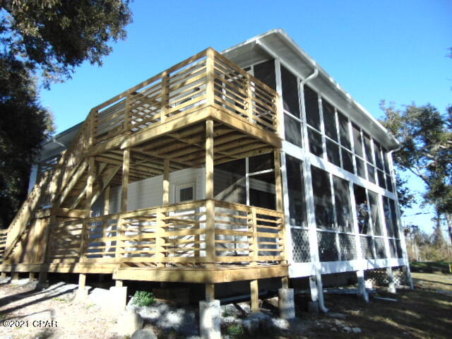 WATER FRONT!  3 bedroom 2 bath upstairs unit!  This apartment features an open floor plan with a great view of the water, kitchen with stainless steel appliances, granite counter tops, LVP flooring throughout, large bathrooms, laundry closet for a full size stackable W/D, large screened in porch facing the water, and a open patio for grilling.  This property is on Bay County Water, septic an has a lawn pump.  ALL Electric!

Property is on Newman Bayou that goes out to West Bay and the Gulf.  Boat landing is just across the street from the property.