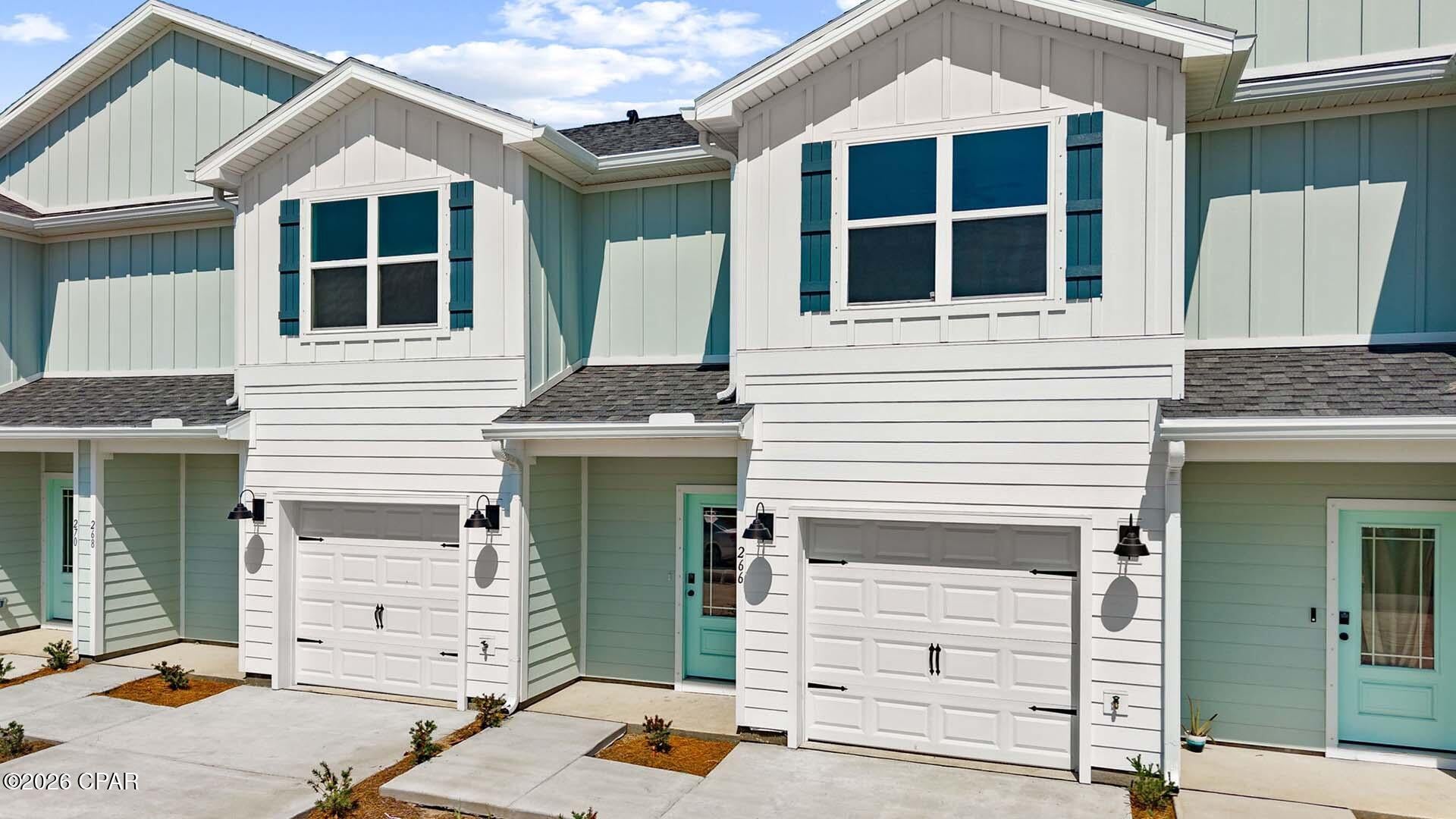 Welcome to 251 Phillips Bluff Avenue, a new home under construction at Colonial East Townhomes in Panama City Beach. This townhome is an interior unit with a pond view from the back patio. This floor plan has a bright foyer leading to the expansive open-concept kitchen, living, and dining area, designed for entertaining and everyday living. The kitchen is open and spacious with a center island and overlooks the main living area. 

The first floor is heart of this home, while the privacy of the second level holds all bedrooms, ensuring a quiet retreat. The primary bedroom has a generous size closet and a private bathroom with dual sink vanity, and ample linen storage, and a large shower. Additional bedrooms share a hall bath, creating a comfortable space. This townhome has EVP flooring throughout the main level and carpet on the stairs and upstairs hallways. The kitchen and bathrooms have white cabinetry that complement the quartz countertops, and an appliance package is included with a stove, microwave and dishwasher.

A Smart Home Technology Package comes standard, featuring a Qolsys IQ touch panel for thermostat and lighting control. Exterior features of Colonial East townhomes are equally impressive, with Hardie® siding, composite shingle roofing with a 30-year warranty, and thoughtful lighting at the garage, front entry, and back patio. A landscaped front entry adds curb appeal and welcomes you to your very own slice of Florida paradise.