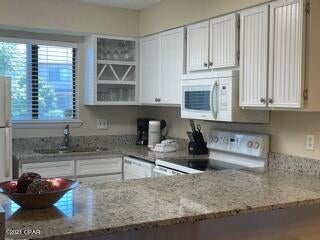 Don't miss out on this updated vacation rental in Portside!  This unit performs well as a vacation rental for an investment, and would also make a nice primary residence.  A great location close to our sugar white sand beaches and pier park.  The most recent updates include new flooring, carpet, and granite countertops. A complete list can be found in the documents section.