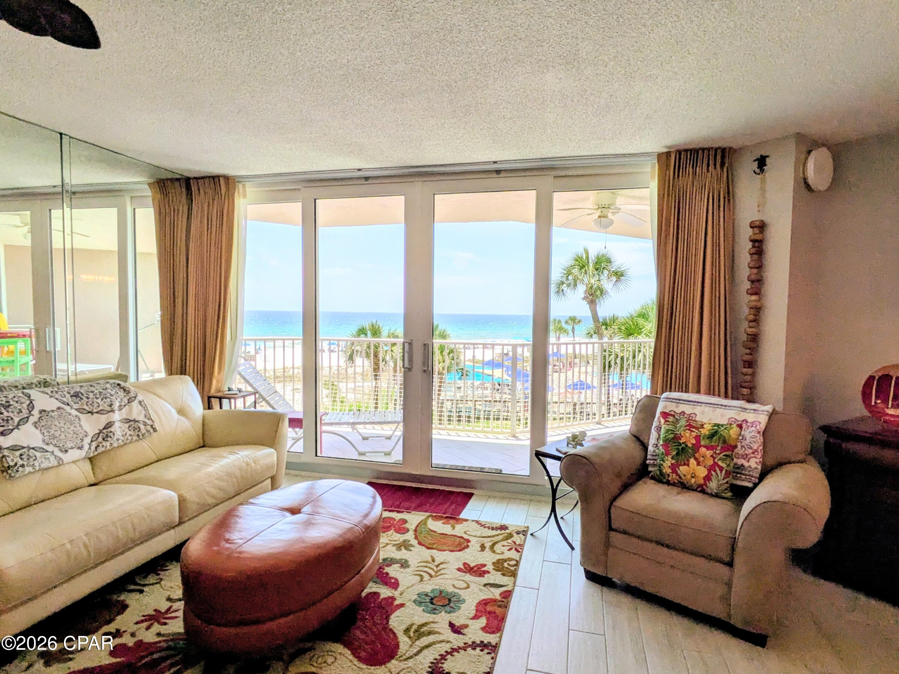 Dunes of Panama E304 - Great opportunity to own this updated and perfectly situated deluxe 2bed/2bath, 1,289sq.ft. Gulf front condo!  The Gulf front balcony spans the width of the condo with perfect Gulf front views from the kitchen, living room, master bedroom, and the balcony also overlooks one of three pools!  Watch endless sunsets from this much sought after lower-level floor condo that renters desire!  The Dunes of Panama Resort has 1500 linear feet of sugar white sand, 3 gulf front pools (one heated), four pickle ball courts, one tennis court, free WI-FI, fitness room, shuffleboard, outdoor BBQ grills, Stingray's restaurant and gift shop and the Sneaky Tiki poolside.  A/C 2015, Water Heater 2018, Appliances 2018, W/D 2020, Microwave 2025.  Has been a non-rental and part time home of the owner so there is no rental history.  It would easily be a turnkey rental and similar units generate over $45K annually.  All dimensions and information herein are deemed reliable but should be verified by buyer.
