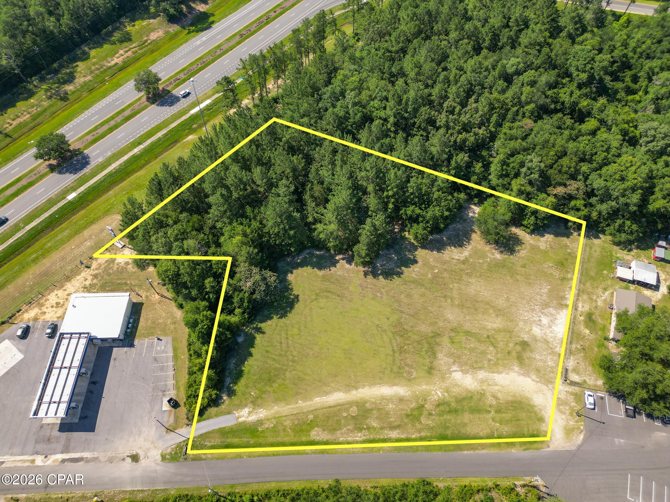 Prime commercial opportunity with approximately 3 acres ideally positioned near the Highway 77 corridor and just minutes from I-10. This high-visibility property offers some frontage along Highway 77, with the remaining frontage along Blue Lake Road for convenient access. The DOT traffic count for Highway 77 is approximately 8,900 vehicles per day, providing strong exposure for a wide range of commercial possibilities. With excellent visibility, accessibility, and proximity to major travel routes, this site is well-suited for retail, office, service-based businesses, or future development. Whether you are looking to establish a new business location, expand your footprint, or invest in a growing area, this property offers location, convenience, and opportunity in one package.