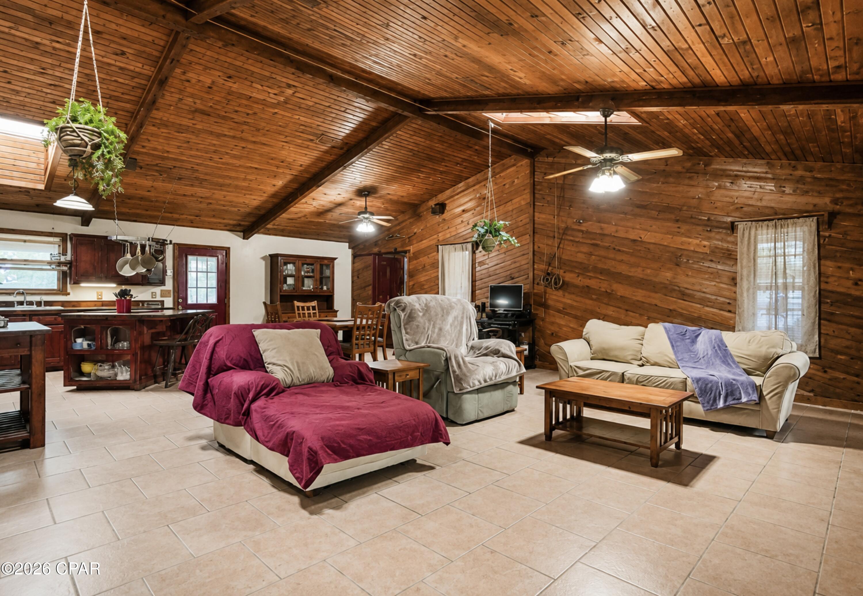 Have you ever dreamed of having your own horses, a flourishing garden, and a peaceful retreat away from the hustle and bustle? This inviting country property makes that dream possible. Set on 1.88 acres, the home offers an exceptional blend of privacy, character, space, and opportunities for outdoor enjoyment.

A fenced portion of the yard provides a secure area for children or pets while preserving the freedom and beauty of the larger parcel. With ample room for horses, gardening, recreation, and peaceful country living, this property offers the space to create the lifestyle you have always imagined.

Inside, the spacious great room serves as the heart of the home, featuring dramatic vaulted cedar ceilings and a warm cedar accent wall that adds natural beauty and timeless charm. Skylights throughout the home fill the interior with soft natural light, while the generously sized bedrooms provide comfort and flexibility.

The impressive 17x15 primary suite includes a private en suite bath and an additional attached room, ideal for a sitting room, home office, dressing room, nursery, exercise space, or private retreat. An attic fan provides added ventilation and may help improve the home's overall comfort and energy efficiency.

Step outside to enjoy the pool, screened porch, and expansive grounds designed for both relaxation and productivity. Garden enthusiasts will appreciate the two existing raised beds, abundant space for additional gardens, and a remarkable blueberry patch known to produce approximately 100 pounds of blueberries each year. The property also features two pear trees, one pecan tree, and two Japanese persimmon trees.

Storage and workspace are plentiful. A 23x10 workroom or hobby space is conveniently located near the living room, while the wired 26x12 carpentry workshop, with tools, offers plenty of room for serious weekend projects or everyday tasks. The property also includes a 12x7 storage shed, a 6x8 garden shed, and a carport.

The home is equipped with a dedicated auxiliary power circuit box designed for use with a dual-fuel Westinghouse generator, offering added convenience, comfort, and peace of mind during power outages. Real storm shutters provide additional protection, while the 350-foot well offers fresh, pure water. The septic system was pumped in 2023.

The Westinghouse generator, workshop tools, and one-year-old Cub Cadet 50-inch riding lawn mower may convey with an acceptable offer.

From quiet mornings on the screened porch and afternoons beside the pool to harvesting fresh fruit, tending the garden, completing projects in the workshop, or caring for your horses, this one-of-a-kind property offers a gracious country lifestyle with room to grow, gather, and truly feel at home.