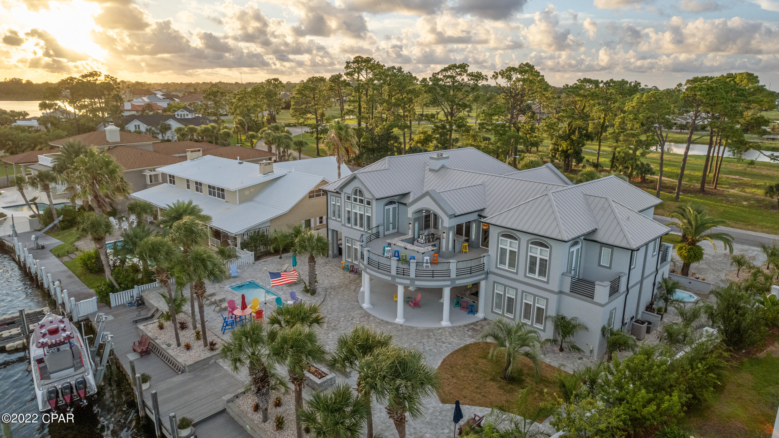 This property has sold! Discover similar listings by reaching out to us for an updated list of available properties that match your preferences.

 **24x30 POOL CAN BE ADDED | SEE RENDERINGS** If you're looking for the ultimate waterfront estate, look no further. This amazing home has been entirely redesigned and finished in 2022 and boasts Italian marble floors, intricate woodwork, and incredible indoor and outdoor living spaces....right on the water. Built for entertaining, 4522 Bay Point Road features over 8,300 sq. ft. under roof and over 6,500 sq. ft. of conditioned space. Featuring two master suites with amazing bathrooms and spacious closets and three additional suites, all with custom baths and private balconies, there is plenty of room for the entire family and your guests. Multiple gorgeous bars, a home movie theater, game room and a stunning kitchen are just a few of the highlights. Make an appointment to view today.