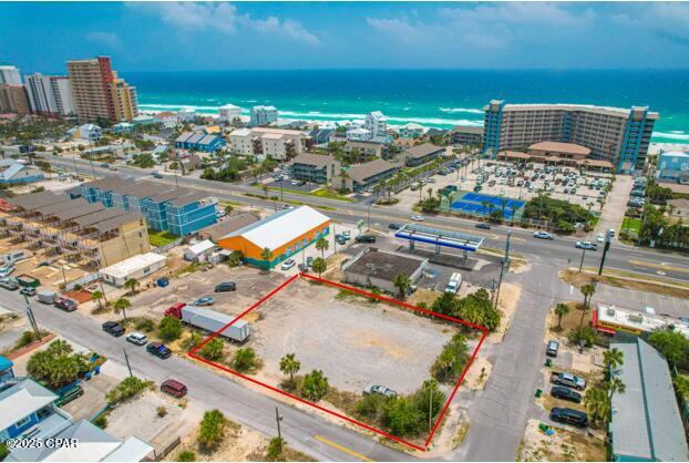 Prime Commercial Development Opportunity - Investors, Builders & Entrepreneurs Take Notice! 

An exceptional opportunity awaits on Beach Drive in the heart of Panama City Beach, just 900 feet from the Gulf of Mexico! This rare offering includes three combined lots totaling 150' x 115' (.40 acres)--ideally positioned for high-visibility development in a vibrant and rapidly growing area.

Property Highlights:

Zoned C-1 (Neighborhood Commercial) - Grandfathered-in status with broad development flexibility
Development Order: Will be in place within a week to build five +/- 1800 sq ft homes
Location: Surrounded by new construction homes, high-rise condos, restaurants, public beach access, and major attractions
Not in a flood zone - despite being only steps from the beach!
High visibility - Excellent for commercial, mixed-use, or multifamily development

📐 Zoning & Development Details:

Zoning: C-1 Neighborhood Commercial
Density: Up to 15 units per acre
Max Building Height: 35 feet
Impervious Surface Ratio: 60%
Floor Area Ratio: 100%
Setbacks: 20 ft front/rear, 5 ft sides
Minimum Lot Frontage: 70 ft

Why This Property?

Development order saves you time and money - skip the delays and start building quickly
Rare grandfathered-in property with flexible zoning
High-demand area with both tourist traffic and residential growth
Ideal for commercial retail, short-term rentals, townhomes, mixed-use, or multifamily units

Whether you're planning to develop according to the existing development order, launch a dynamic new business, or secure a valuable asset in one of Florida's most coveted coastal markets, this property checks every box.