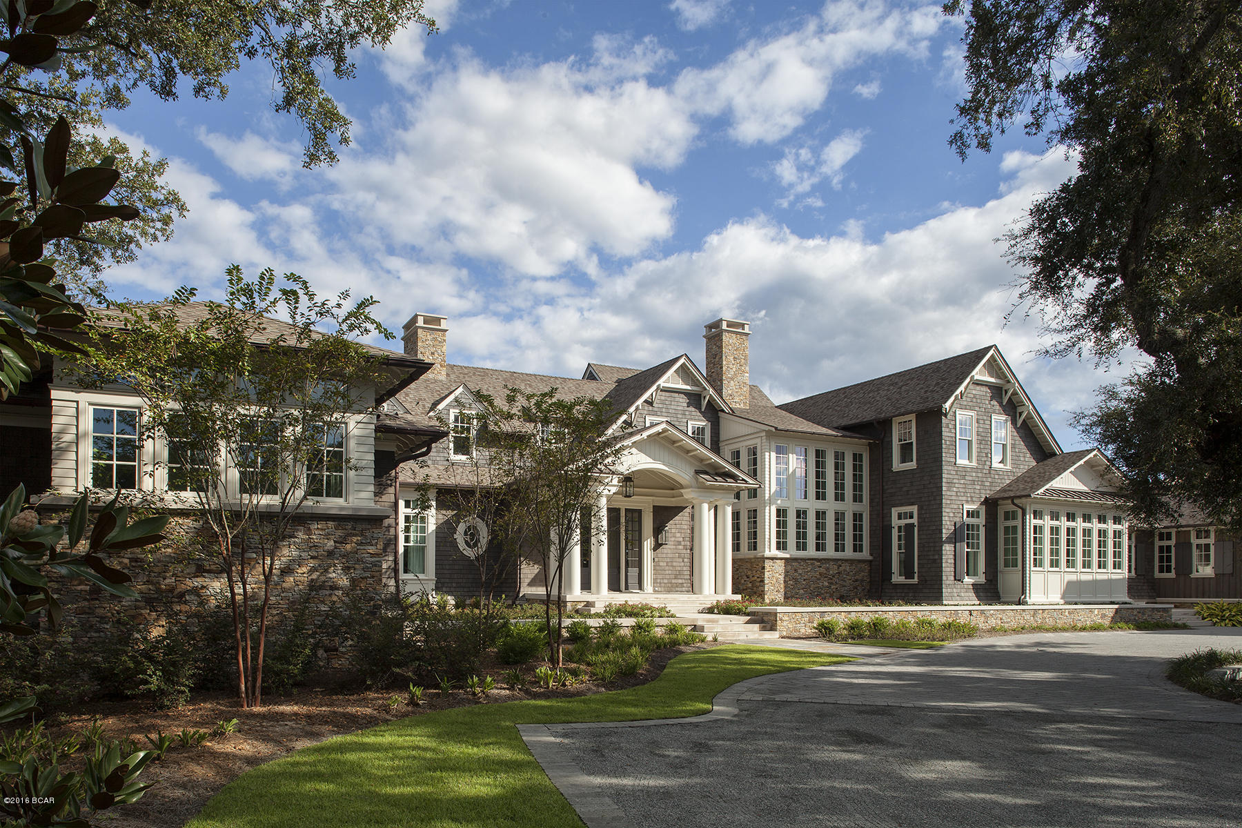 Magnolia Manor is a three-year collaboration between renowned architect Eric Watson of Tampa, Florida and Northwest Florida’s premier builder, Clifford Myers of Panama City, Florida.  The home features 8'' maple plank flooring throughout and Indiana Limestone on the exterior.  The gourmet kitchen features marble counter tops by Morgan Creek in Atlanta, Georgia and a full package of top of the line appliances.  The basement houses a sound proof media room with state of the art equipment.  The home is equipped with a full security system and features a safe room with dedicated communications and complete security camera monitoring.  This home offers many state of the art features including smart house technology, geothermal heating and cooling system with each room being independently... thermostatically controlled, and a whole-house generator which will provide full electrical service in case of a service interruption.  

There is an attached 3-car garage and carriage house that is fully conditioned as well as a separate fully conditioned four-car garage with workshop.  There is also a dog run and a dog wash on the property.

This Nantucket-style mansion is located on 2.6 acres in the historic Dellwood Beach neighborhood.  The lot features over 200 feet of waterfront on historic St. Andrews Bay providing deep water access to the Gulf Pass.  Surrounded by other exclusive residences, Magnolia Manor offers the privacy that is desired by the discriminating buyer.

Any potential buyer will be pre-qualified before being allowed to view this property.

The seller will consider a real estate trade as partial payment of the sales price.