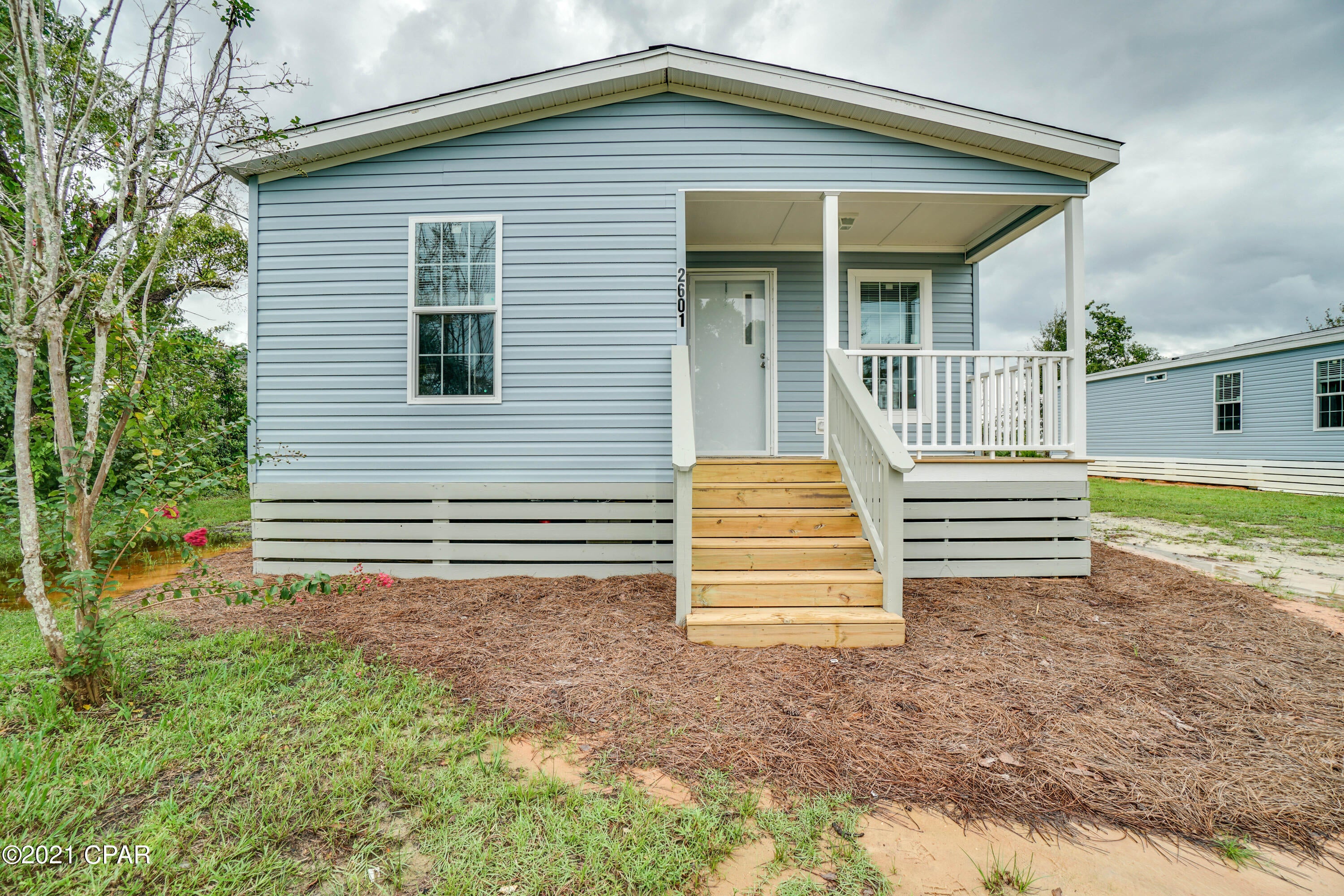 Here's your opportunity to own a brand new home! Roads surrounding this location are being repaved this fall. This is a brand new cottage style home in a central location. This never been lived in before is a 2021 home. Double wide with oversize kitchen with island and tile backsplash. LVP flooring throughout with carpet in the bedrooms. Trey ceiling in living room. Front bedroom can be used as bonus room, play room, or office. Master bedroom with master onsuite with double vanity, walk in closet.