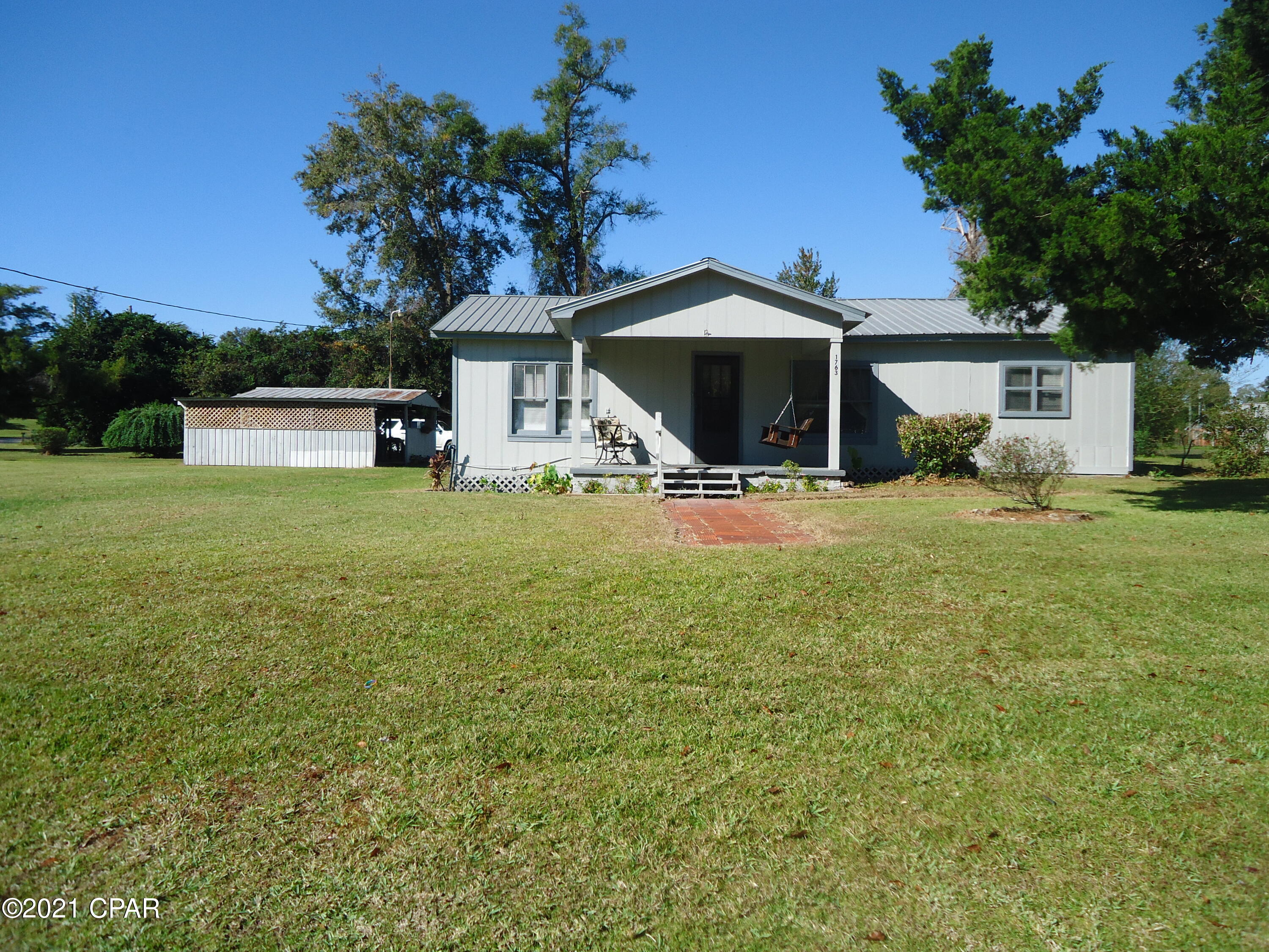 Cute 3 bedroom 2 bath country home on a corner lot in the City Limits of Alford.  This home  is a couple of blocks off Hwy 231... 45 minutes to Panama City and 45 minutes to Dothan. Enjoy the front and back porches.  There's plenty of yard and storage buildings.  Relax in the covered relaxation sitting area.  Must see!
