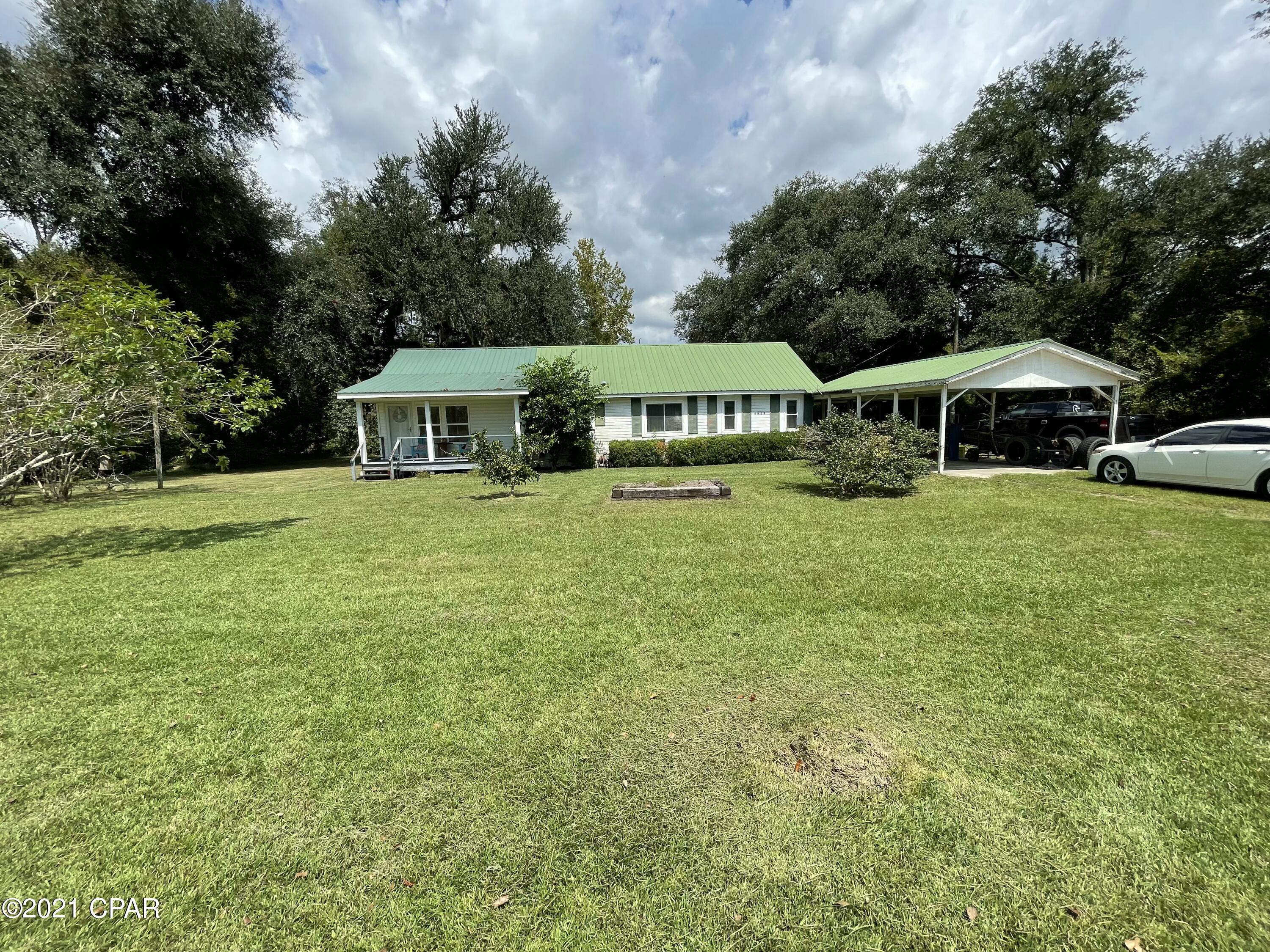 2/1 in a quiet country setting, that is in need of a little TLC but has great potential! The property has a pond on the back side and gorgeous shade trees! Priced to sell with remodel potential but is livable as is! Make an appointment to see!