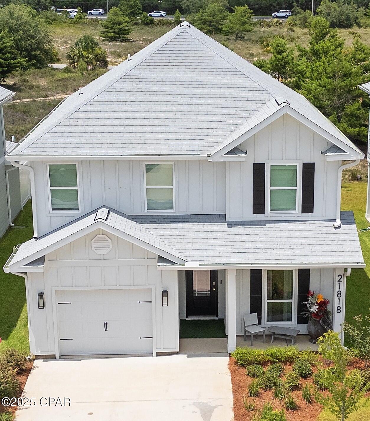 This lovely 4-bedroom, 3.5-bath home is a true showpiece, thoughtfully upgraded with high-end features throughout. From the moment you step inside, you'll notice the designer touches to include custom paint, striking accent walls, and showcase light fixtures that elevate every space. The open-concept floor plan is enhanced by smart home technology, large wall-mounted TVs, and a dedicated media room with surround sound, ideal for entertaining or relaxing in style. The main-level primary suite offers convenience and privacy, while three spacious bedrooms upstairs are complemented by a secondary living room/flex space, perfect as a playroom, teen retreat, or second entertainment area. Additional features include an epoxy-coated garage with air conditioning and an extended paver patio for outdoor living.  Schedule your private tour today and experience the exceptional lifestyle it offers.