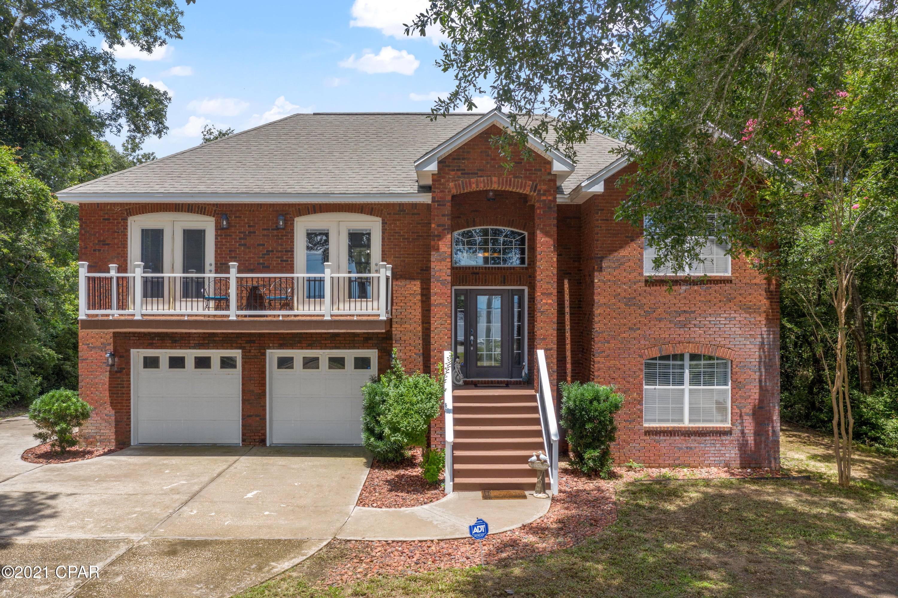 'CURRENTLY UNDER CONTRACT, SELLER ACCEPTING BACKUP OFFERS'  view of Choctawhatchee Bay on nearly three quarters of an acre. Beautiful two story family estate, 3 bedroom, 3 bath with large bonus room, brick home with 75 feet of Bay frontage. Dolphin watching or relaxing while enjoying our wonderful Florida sunsets. This double lot extends from Hwy 20 to Live Oak Rd. Plenty of room for a pool and the additional lot behind to build a spec home or income producing rental home. Split bedrooms upstairs with a full sized recreation room and full bath downstairs. Master bedroom and dining room have private balconies overlooking the bay. Wood-burning fireplace in the living room. Back elevation has elevated deck on second level.