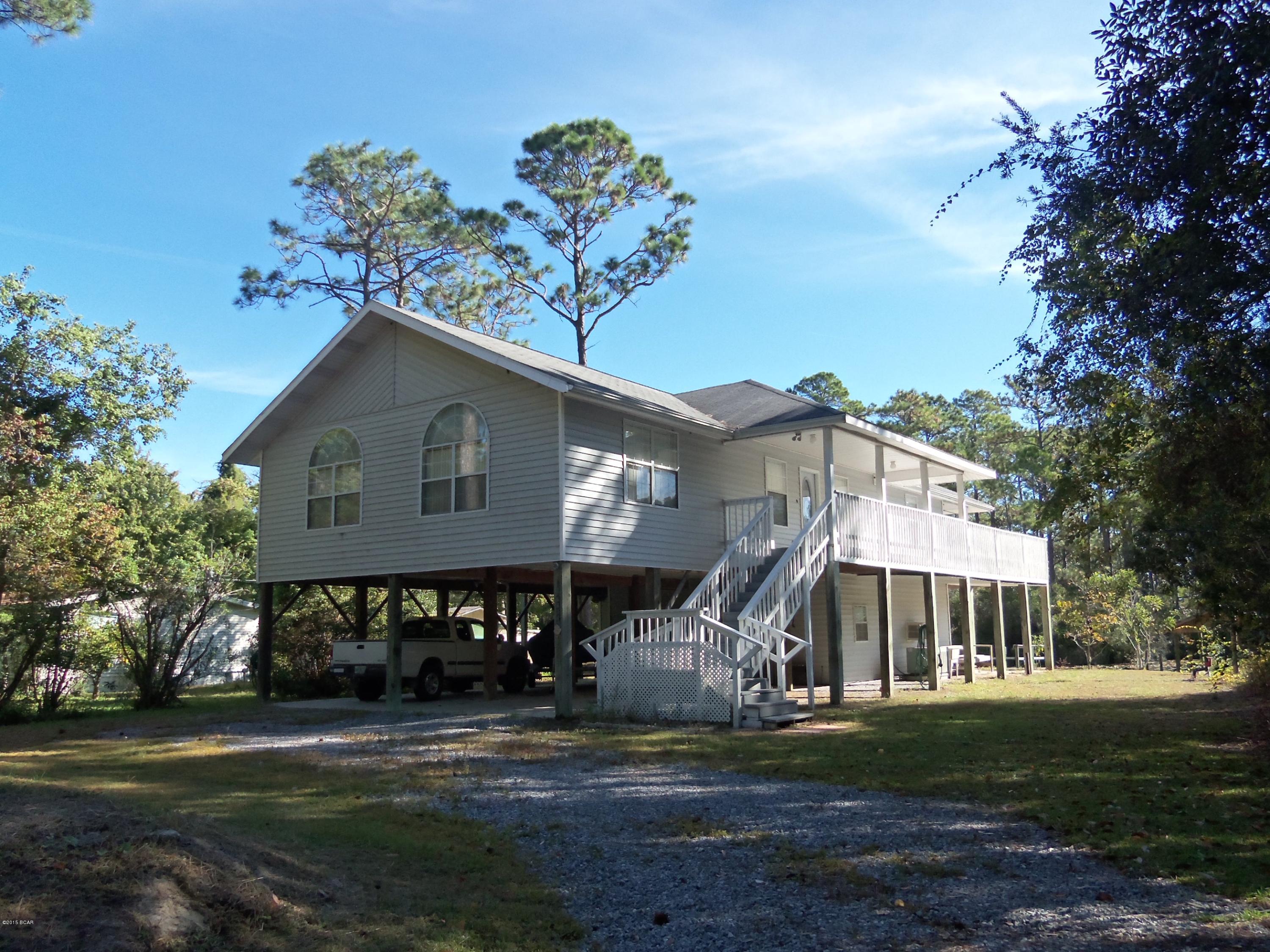 Custom Built Two Story Home Located on Deerpoint Lake Canal. Upstairs offers the Master Bedroom & Bath with two walk-in closets plus an additional bedroom and bath! Office Room, Cathedral Ceilings, Wrap around porch. Downstairs offers a complete guest bedroom!