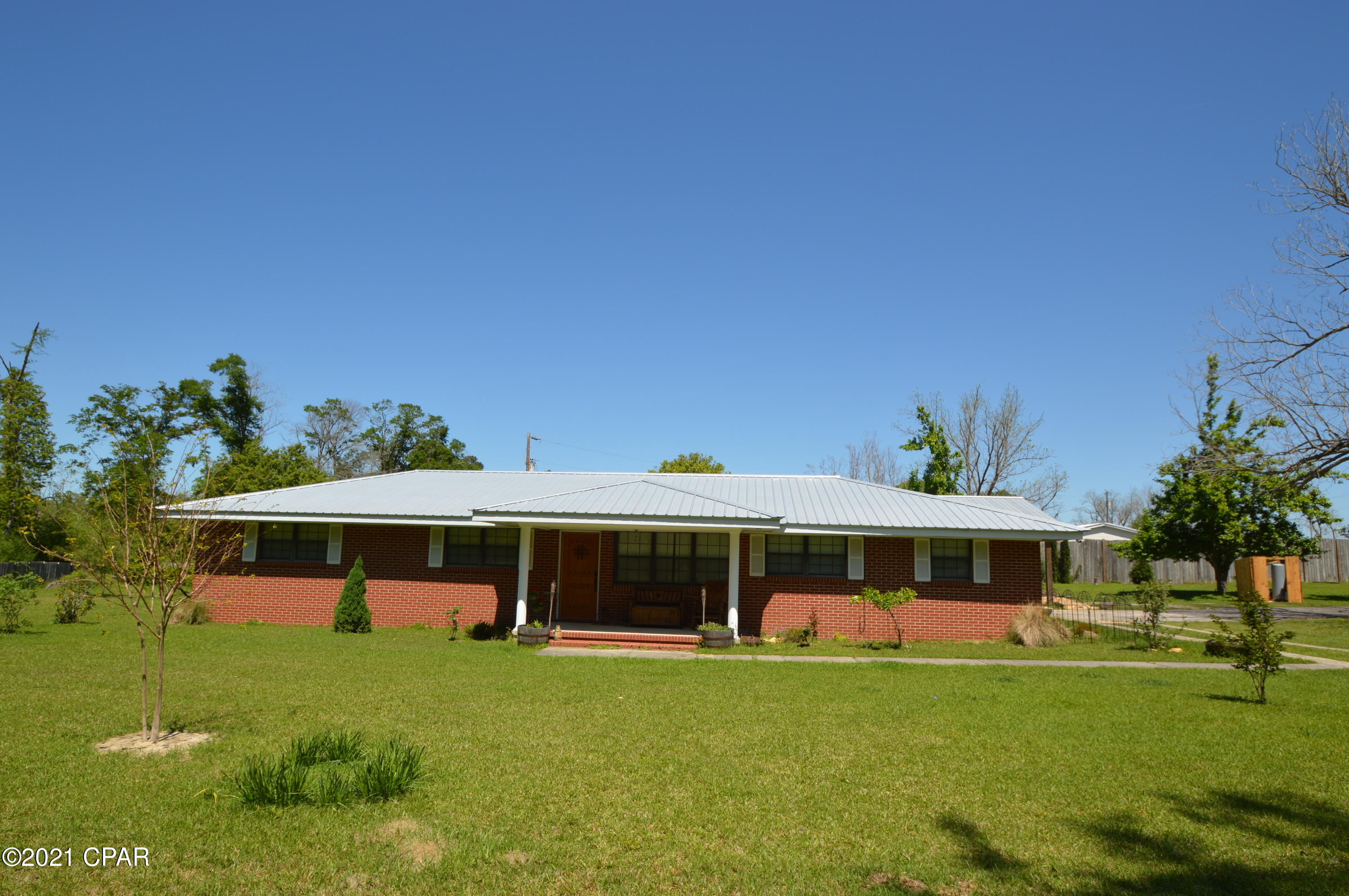Currently Under Contract seller taking back up offers . You will love this open floor plan in this country home. Nice brick home that has had several up grades. New roof , a/c, flooring, plumbing ,new bathrooms, up dated kitchen counter tops ,appliances ,new well and septic system. All this with in the last 3 years and much more. Large yard with all type flowering and fruit trees. Large pole barn and two car carport. Outside storage shed too. More to this property , call for details.