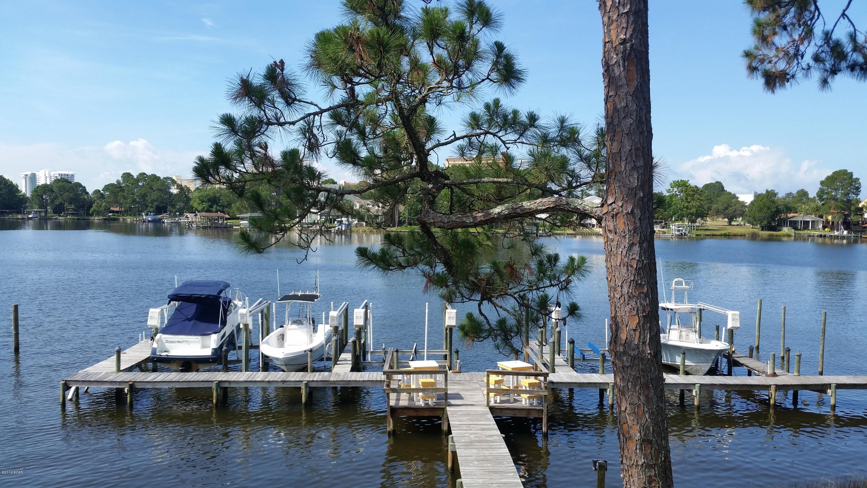 For rent. Lagoon-front 2 bedroom/2 bathroom condo overlooking grand lagoon. This condo is fully furnished and includes a fully stocked kitchen with refrigerator, stove/oven, dishwasher, microwave. The kitchen overlooks the dining and living area with water views from every room. Washer/Dryer inside unit. The large master suite is also waterfront and has access to the balcony. En suite bathroom with shower/tub combination. The 2nd bedroom is also a good size and has access to the 2nd bathroom. This is a rare find waterfront condo on grand lagoon! Rent includes water/sewer, basic cable, garbage. **Pets under 24 pounds considered with $250 non-refundable pet fee.