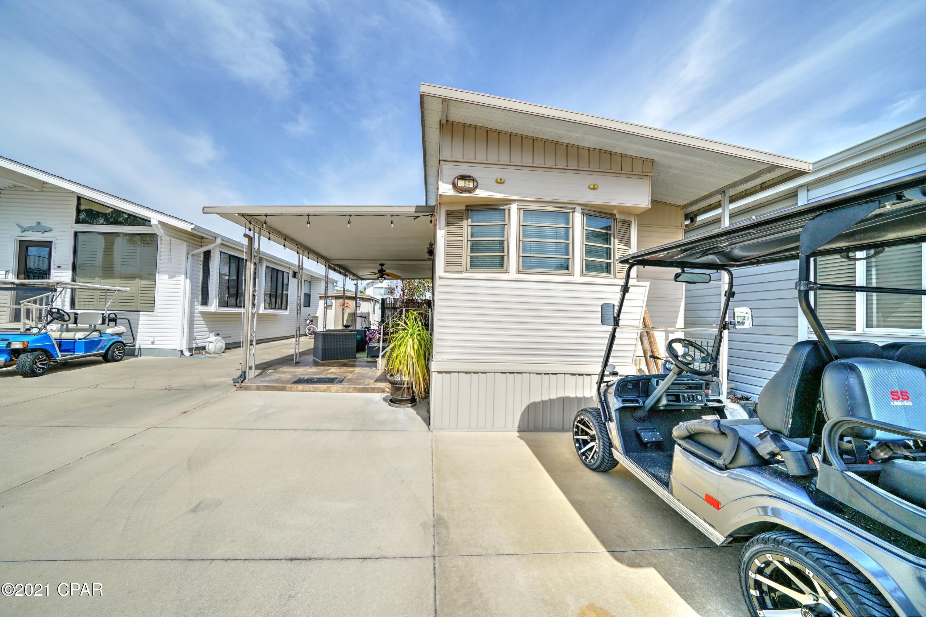 Check out this fabulous 1 bedroom, 1 bath home with bunkbeds in the hall. Owner has just added a new stove and new washer/dryer. Perfect for your second dream home or investment property! Venture Out offers BOTH beach and bay access! The resort has 2 pools, tennis, golf, shuffleboard, playground, basketball, fishing pier, boat dock with slips & boat ramp. Venture Out is a golf cart community that has exploded in popularity within the last few years. A gated, pet friendly community that's great for full time residency or just to vacation. 24 hour security & friendly atmosphere.