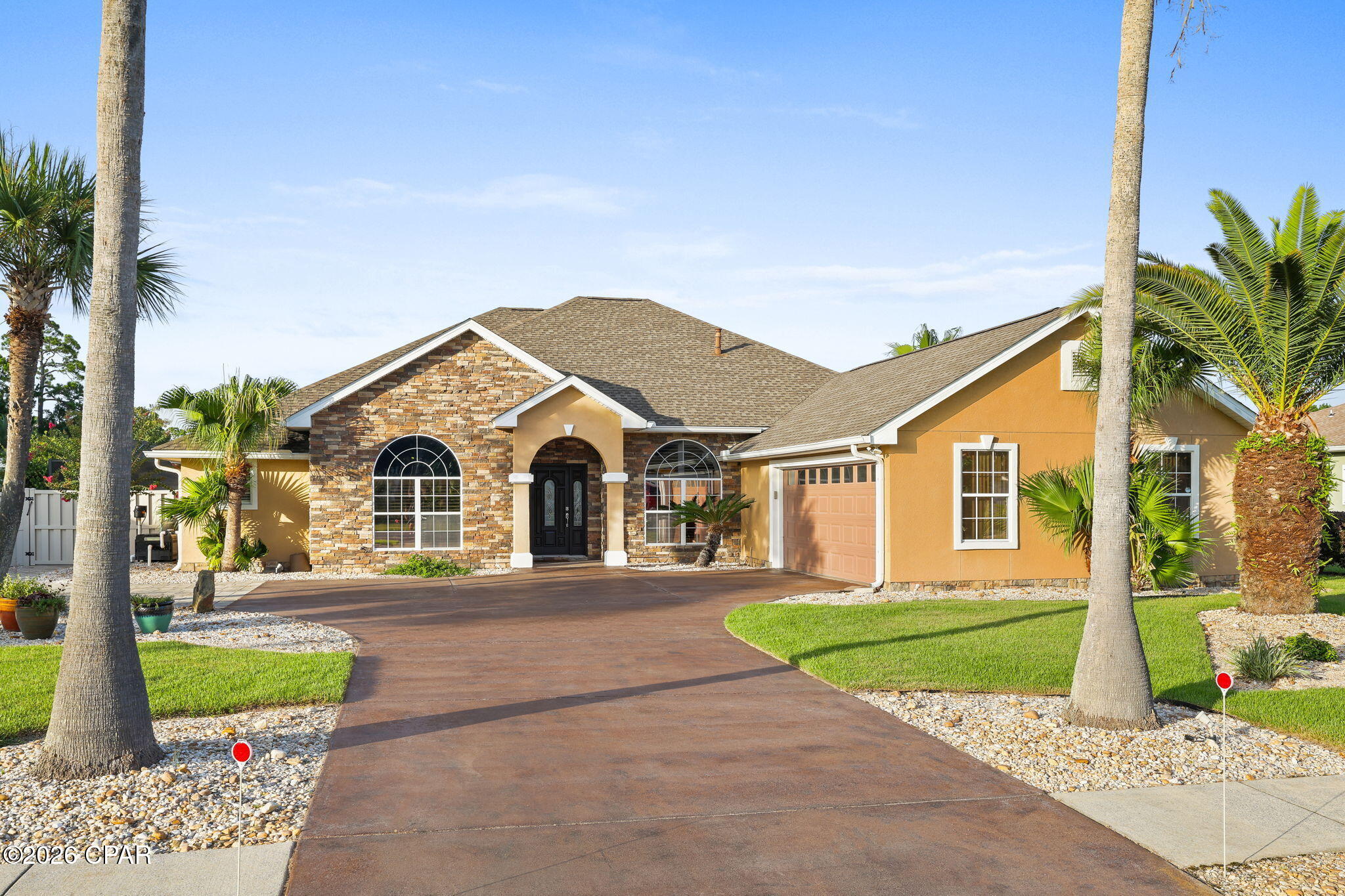 Under Contract - Taking Backups. This spacious 4 bedroom, 2 bath home offers a thoughtfully designed layout with plenty of room for both everyday living and entertaining. From the moment you arrive, you'll notice the large driveway, an oversized two-car garage, beautifully maintained landscaping, and exterior landscape lighting that enhance the home's curb appeal.Step inside to find raised ceilings, recessed lighting, and a combination of tile and LVP flooring throughout. The large, updated modern kitchen overlooks the main living area, creating an inviting space for gathering and entertaining, while a separate dining room is conveniently located just off the kitchen. Two generously sized bedrooms share a full bathroom featuring a double vanity, while an additional room offers the flexibility to serve as a fourth bedroom or home office.The oversized primary suite provides a comfortable private retreat, complete with a spacious en-suite spa like bathroom featuring a walk-in shower, soaking tub, and large custom walk-in closet.The outdoor living space truly sets this home apart. Step outside to enjoy a covered patio, screened-in pool, spacious Florida room which can serve as a home gym, game room, second living space all with abundant natural lighting, and a beautifully designed outdoor grilling area complete with a gas fireplace. Whether relaxing by the pool or entertaining family and friends, this backyard offers an exceptional setting to enjoy the Florida lifestyle.With its spacious interior, impressive outdoor entertaining areas, this home has plenty to offer!

Bonus Features include, Whole home generator, Culligan water softener/filtration system, and a  tankless hot water heater.